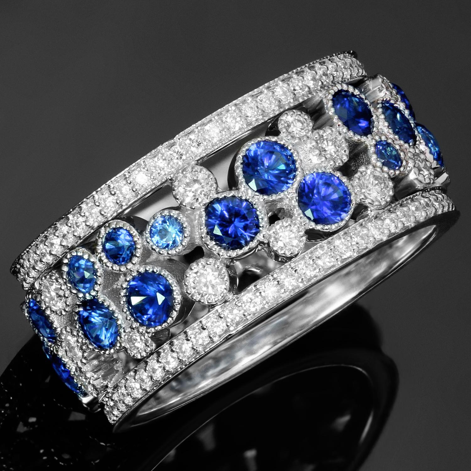 This dazzling wide Tiffany & Co. band from the romantic Cobblestones collection is crafted in platinum and set with multi-sized blue sapphires of an estimated 1.99 carats and brilliant-cut round F-G VVS2-VS1 diamonds of an estimated 0.53 carats.