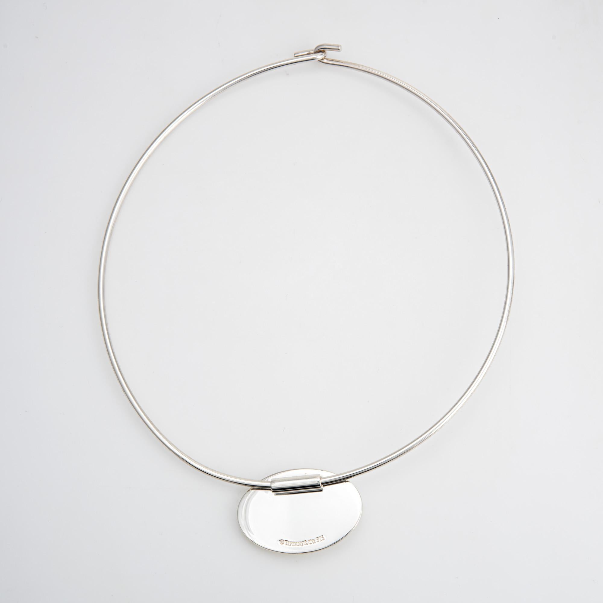Stylish and elegant vintage Tiffany & Co collar necklace crafted in sterling silver.  

The collar necklace is fitted with an oval disc pendant (movable on the collar). Measuring 15.5 inches in length the necklace is designed to sit as a choker on