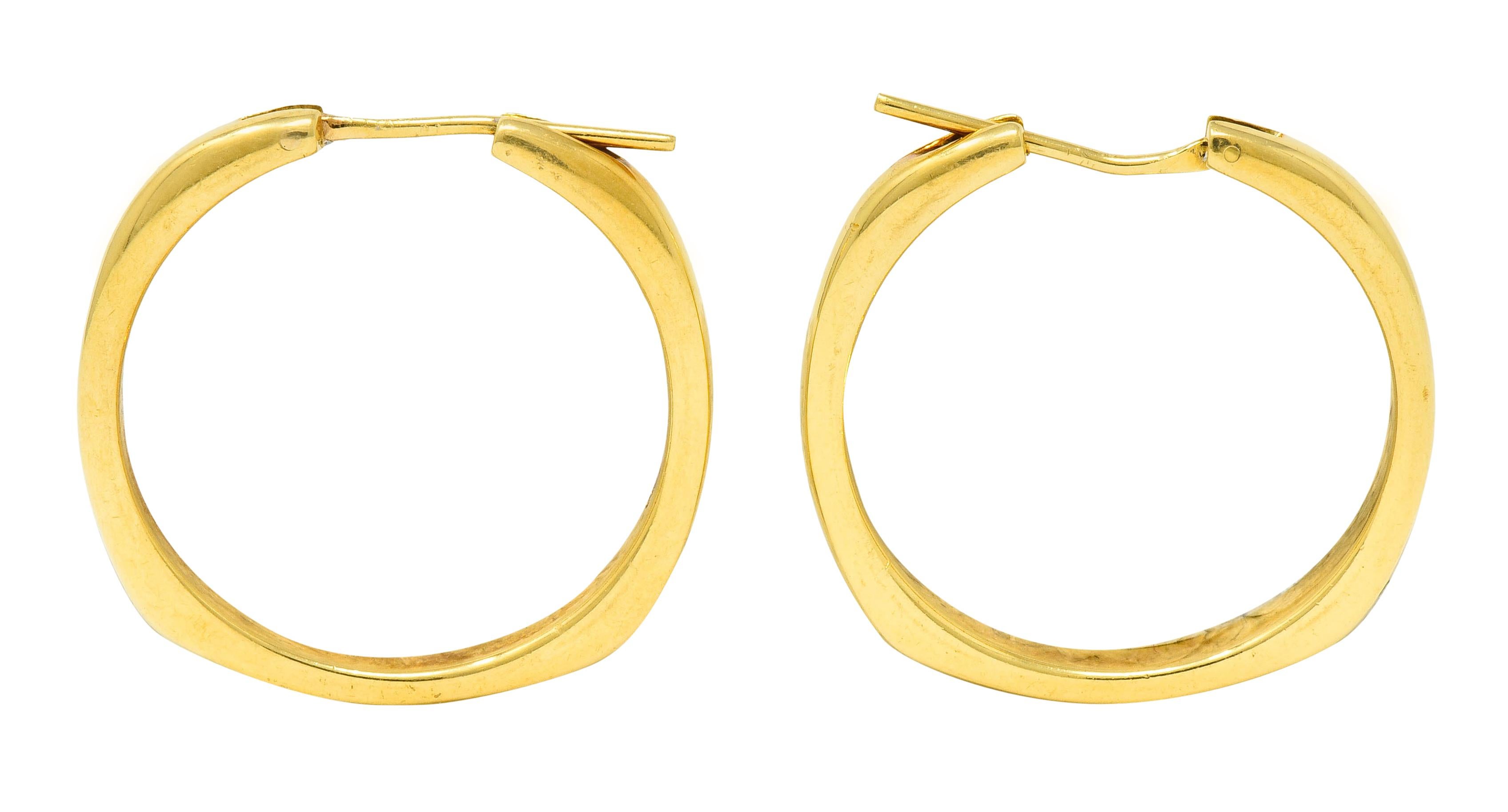 Hoop style earrings designed as a stylized square cushion shape with softly rounded corners

Features a bright finish

Completed by hinged posts

Fully signed Tiffany & Co.

Stamped 750 for 18 karat gold

From the Square Cushion collection, circa