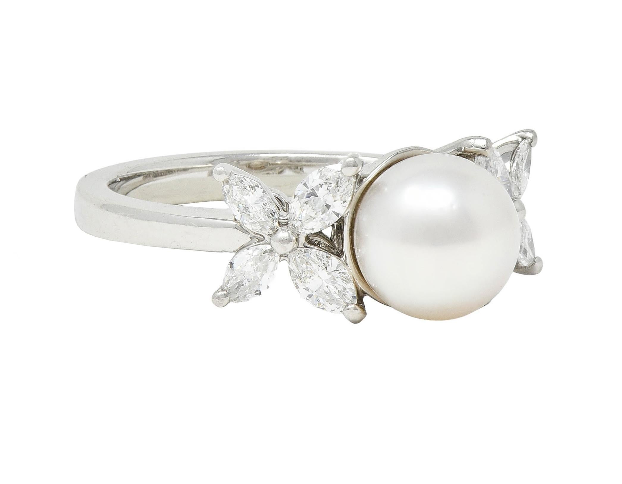 Centering a 7.5 mm round Akoya pearl - white in body color 
With subtle iridescence and excellent luster
Mounted in basket and flanked by cluster shoulders
Comprised of marquise cut diamonds as floral motif
Weighing approximately 0.36 carat total 
G