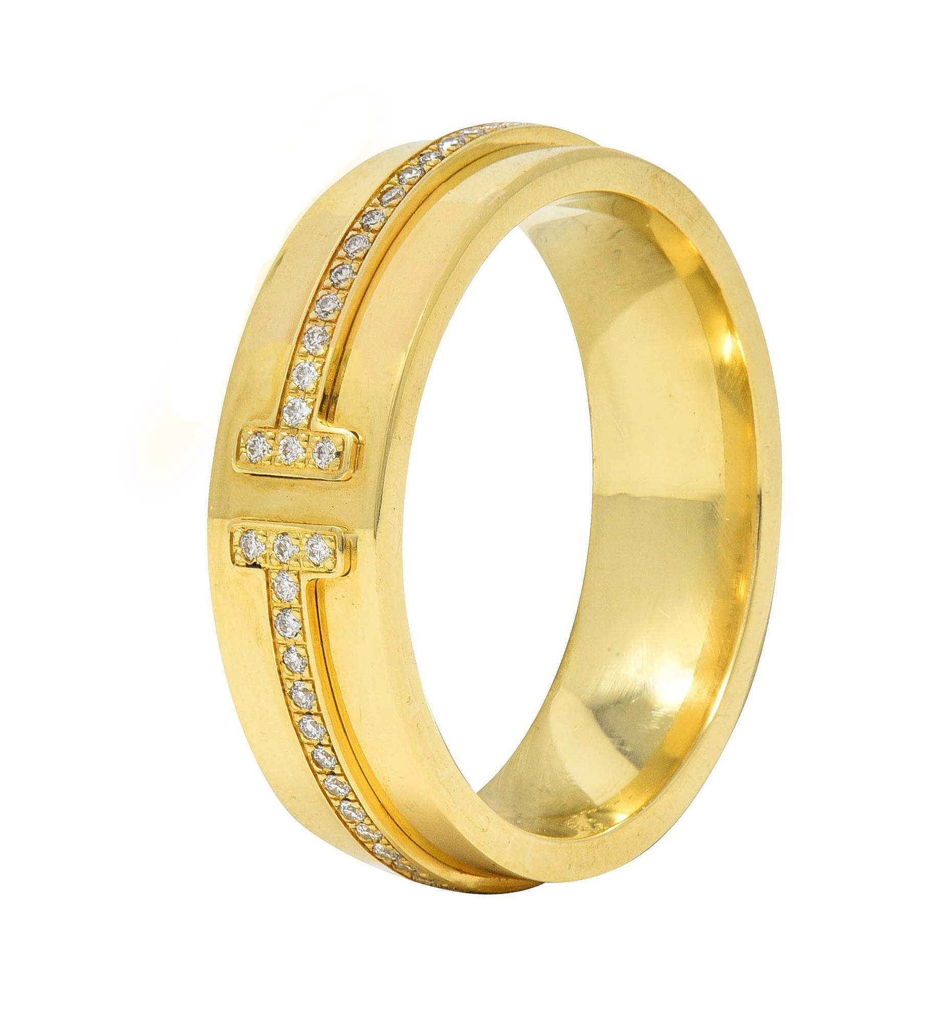 Designed as a wide gold band featuring a raised band terminating with 'T' motif
Bead set throughout with round brilliant cut diamonds
Weighing approximately 0.12 carat total 
G color with VS clarity 
With high polish finish 
Stamped for 18 karat
