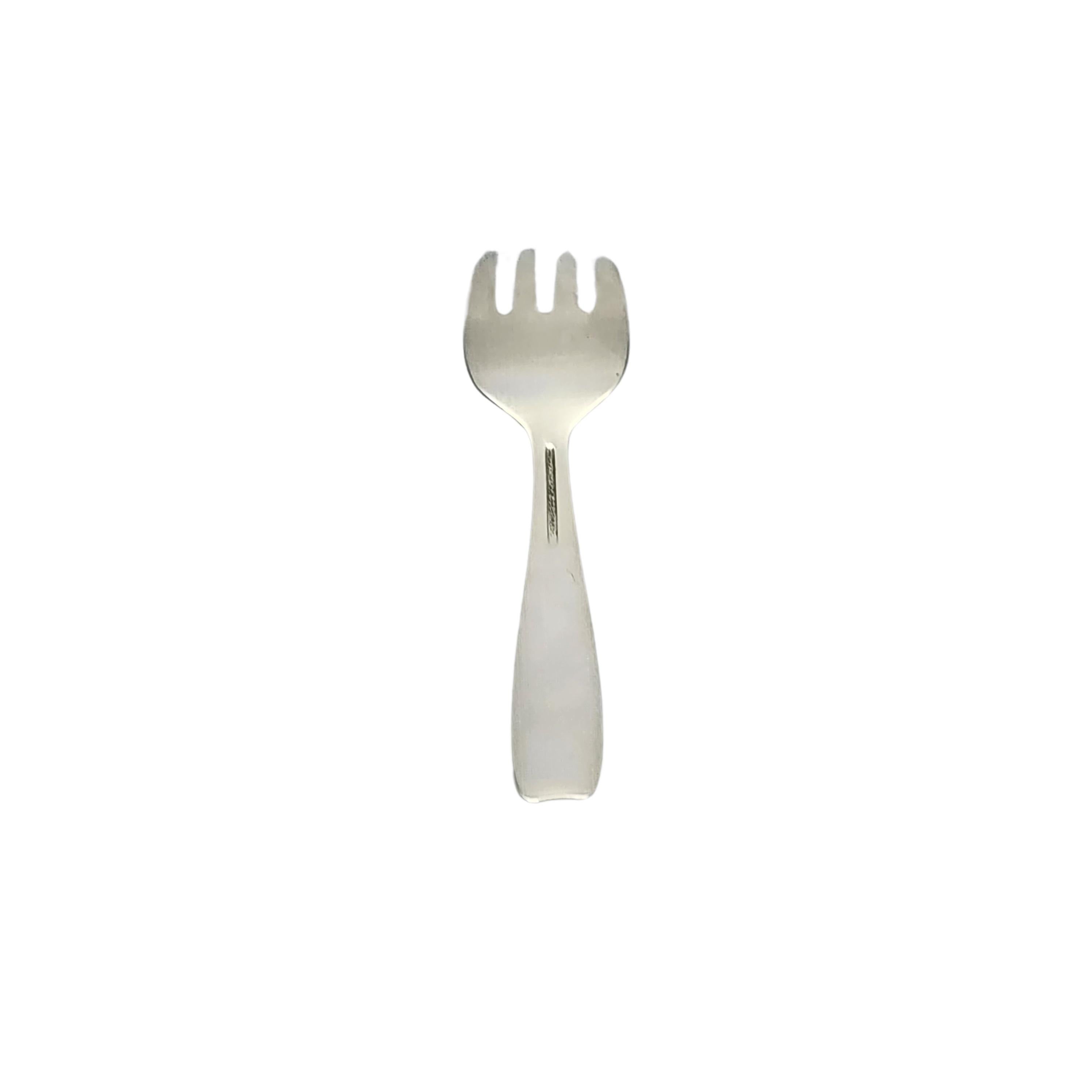 Tiffany & Co sterling silver child/baby feeding fork in the Cordis pattern.

No monogram or engraving

A small fork in the Cordis pattern, a simple and classic design. Hallmarks date this piece to manufacture under the directorship of John C. Moore