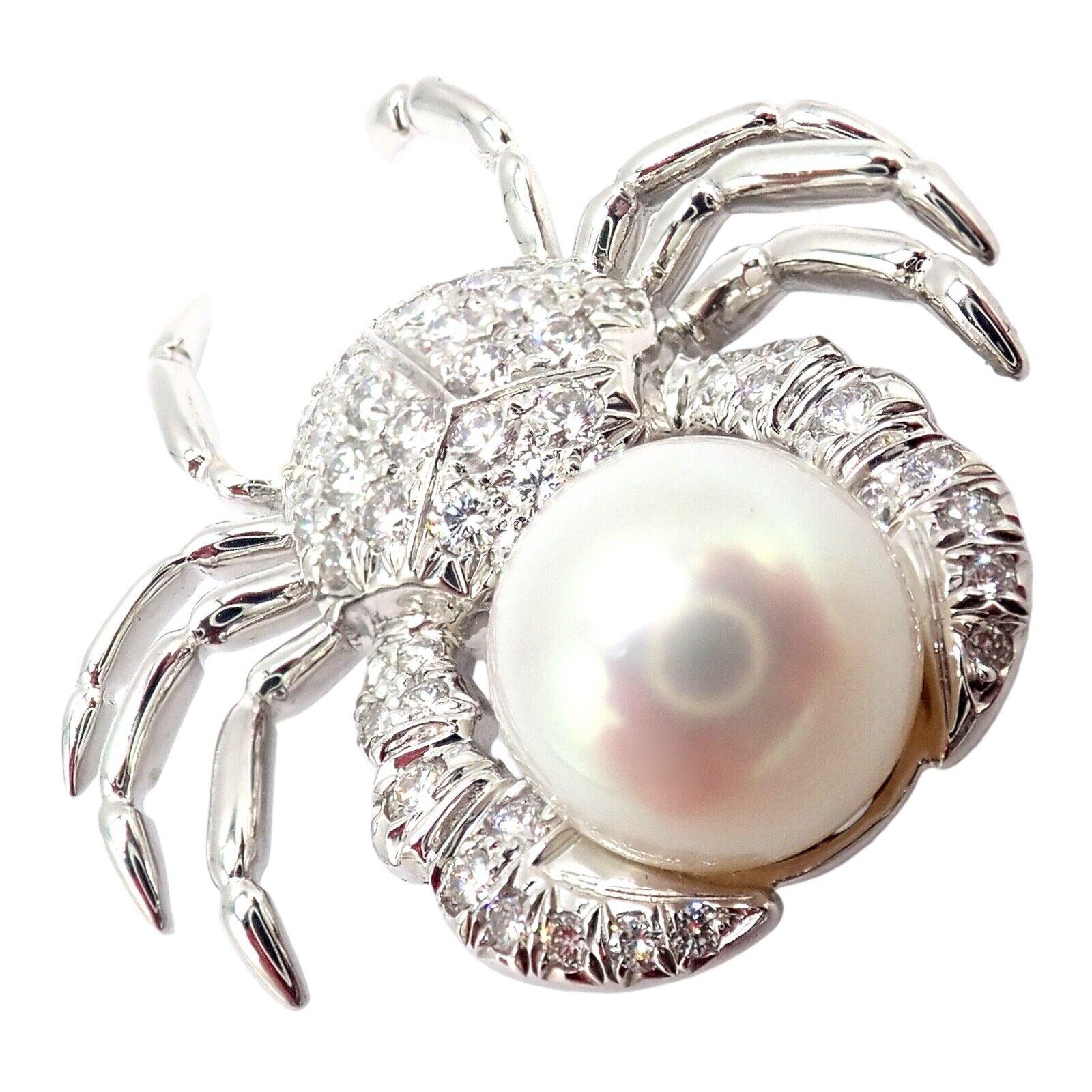 Platinum Diamond Pearl Crab Brooch Pin by Tiffany & Co.
The Tiffany & Co Platinum Crab 1.50ct Diamond Pearl Pin Brooch is a luxurious and whimsical accessory. 
Crafted in platinum, it features a playful crab design adorned with 1.50 carats of