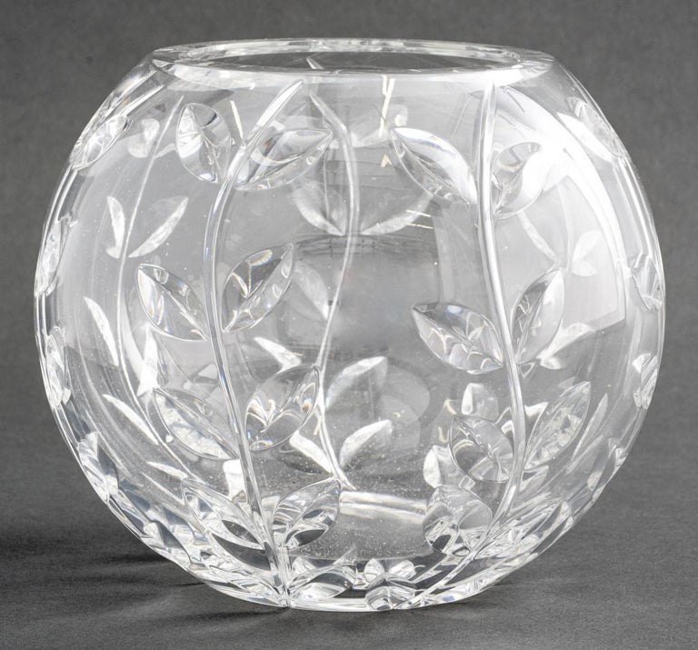 A Tiffany & Co. crystal bowl, designed by Austrian glassmaker Josef Riedel. The bowl features a foliate design and Tiffany and Riedel marks.
Measures: 6.5