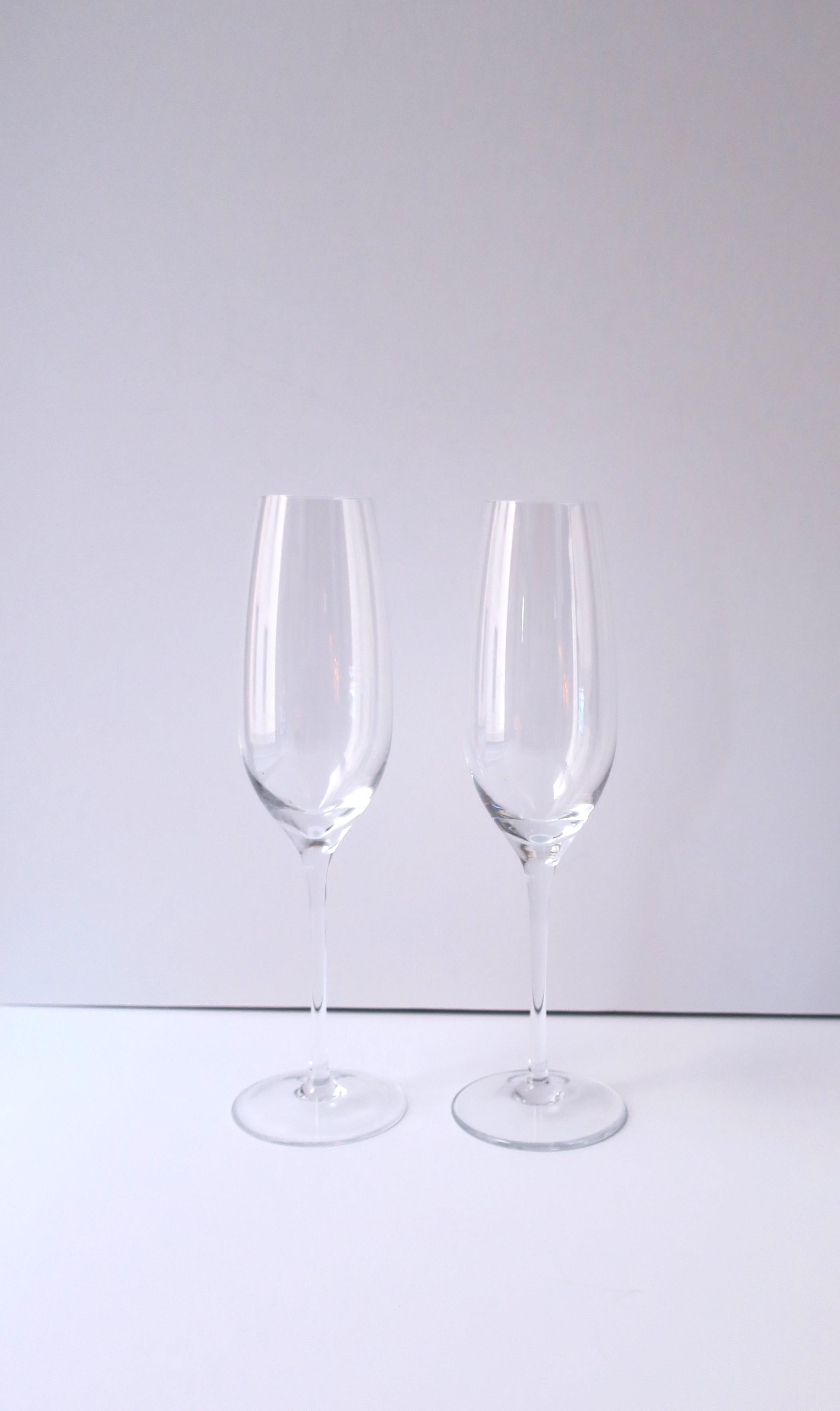 A pair of Tiffany & Co. Champagne flutes/glasses, circa late-20th century. A beautiful pair from luxury American company Tiffany & Co. Markers' mark on bottom of both 'Tiffany & Co.', as shown in last two images A great set for everyday use or