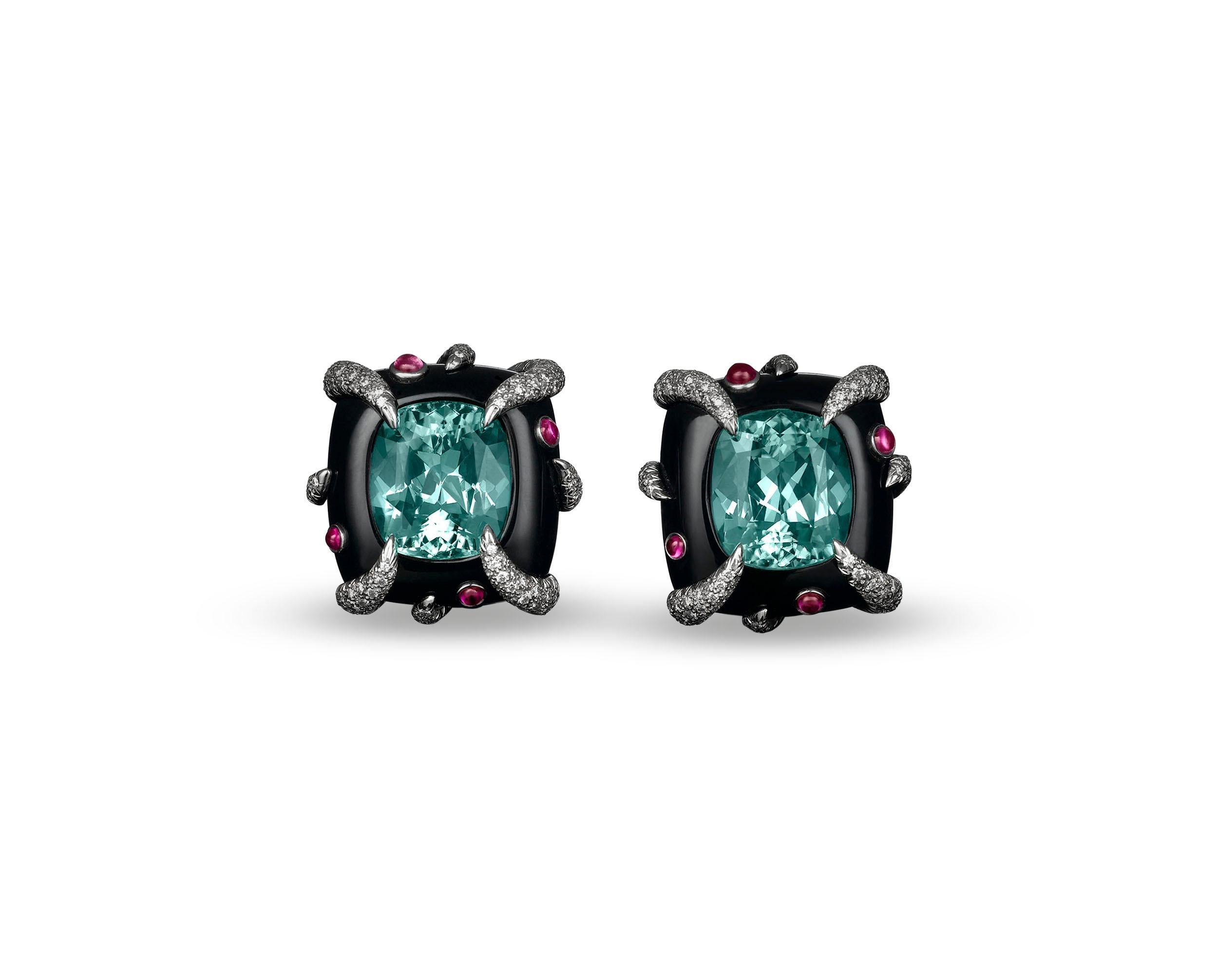 Two fabulous green tourmalines star in this enchanting pair of Tiffany & Co. earrings. Weighing 17.34 total carats, these rare gems sparkle in their sumptuous black onyx settings. Adding to the magnificent aquatic-inspired design are eight pink