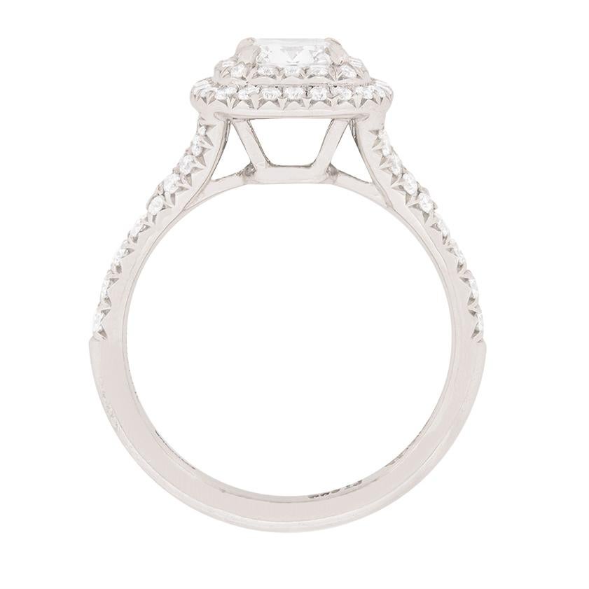 This stunning diamond ring is from Tiffany & Co, with the original makers mark. It features a centre cushion cut diamond weighing 0.71 carat. It has been certificated at Tiffany & Co as F in colour and VVS2 in clarity. This diamond sparkles within