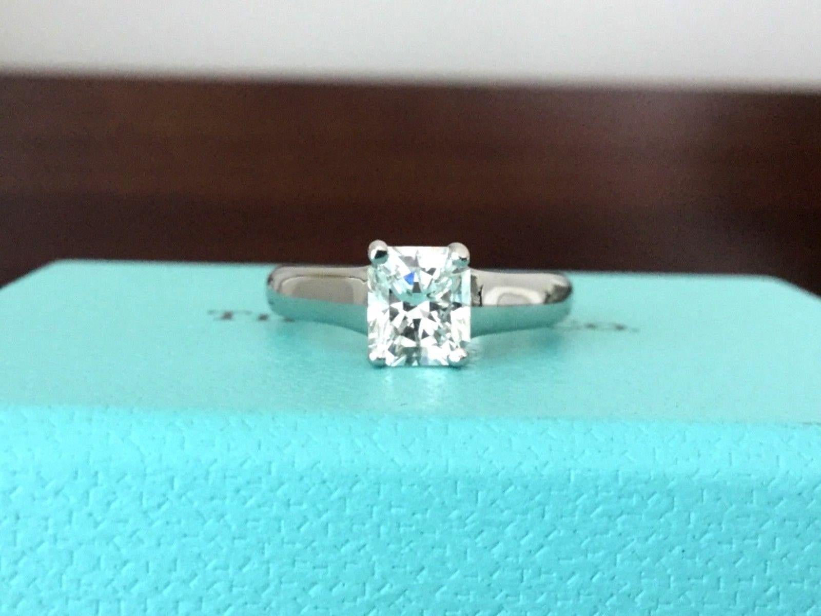 

For your consideration is a Tiffany & Co engagement ring with a .83 carat cushion cut diamond. 
This amazing ring has a LUCIDA cut cornered square natural center stone that is .83 carats, G in Color and VS1 in Clarity and EXCELLENT cut and Very