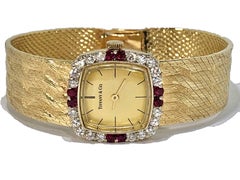 Tiffany & Co. Cushion Shaped Diamond and Ruby Bezel Watch in Yellow Gold