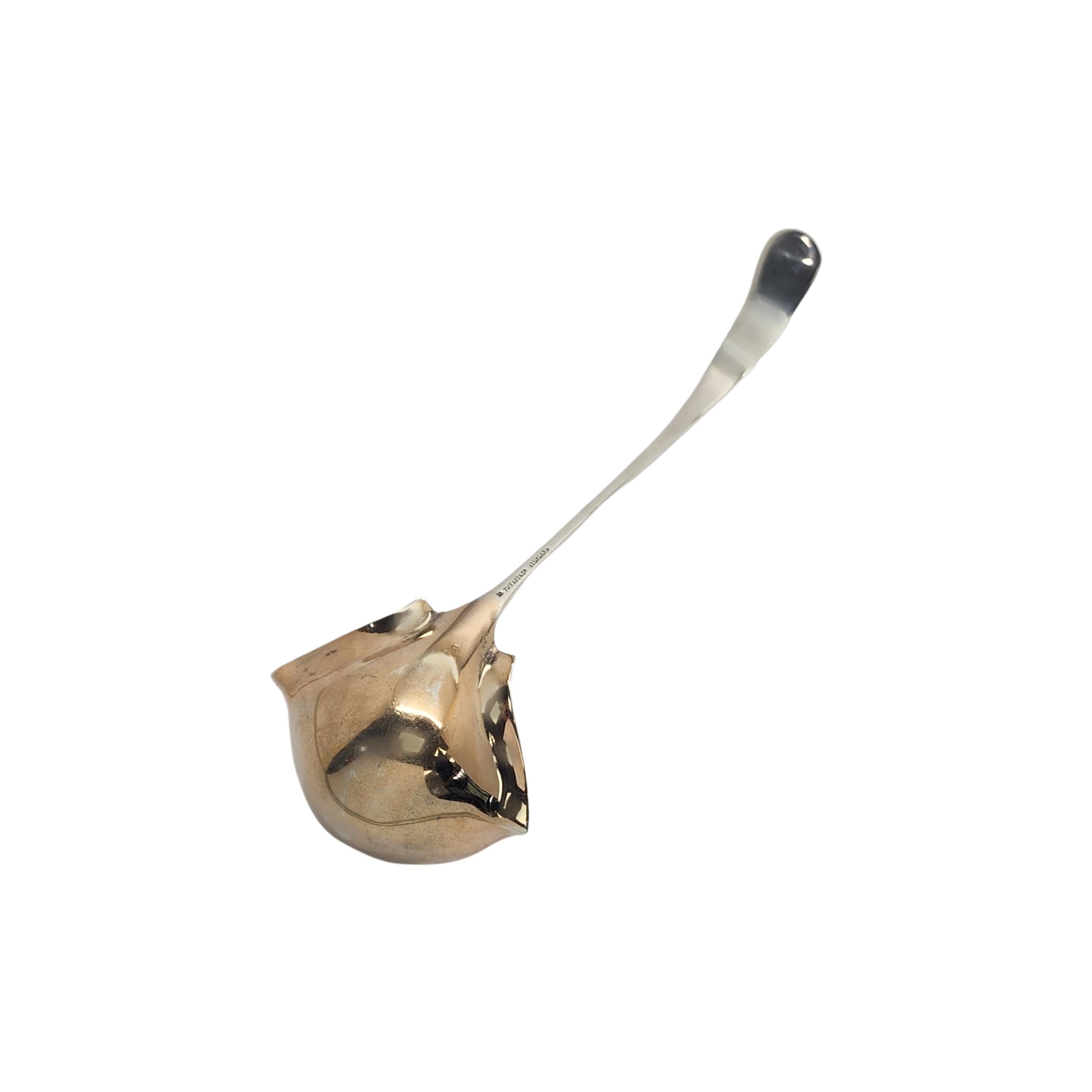 Tiffany & Co sterling silver double lipped cream ladle in the Custom Engraved pattern by Tiffany & Co.

No monogram

Beautifully etched floral design, shovel-like scoop with gold wash bowl. Does not include Tiffany pouch and box. 

Measures approx 7