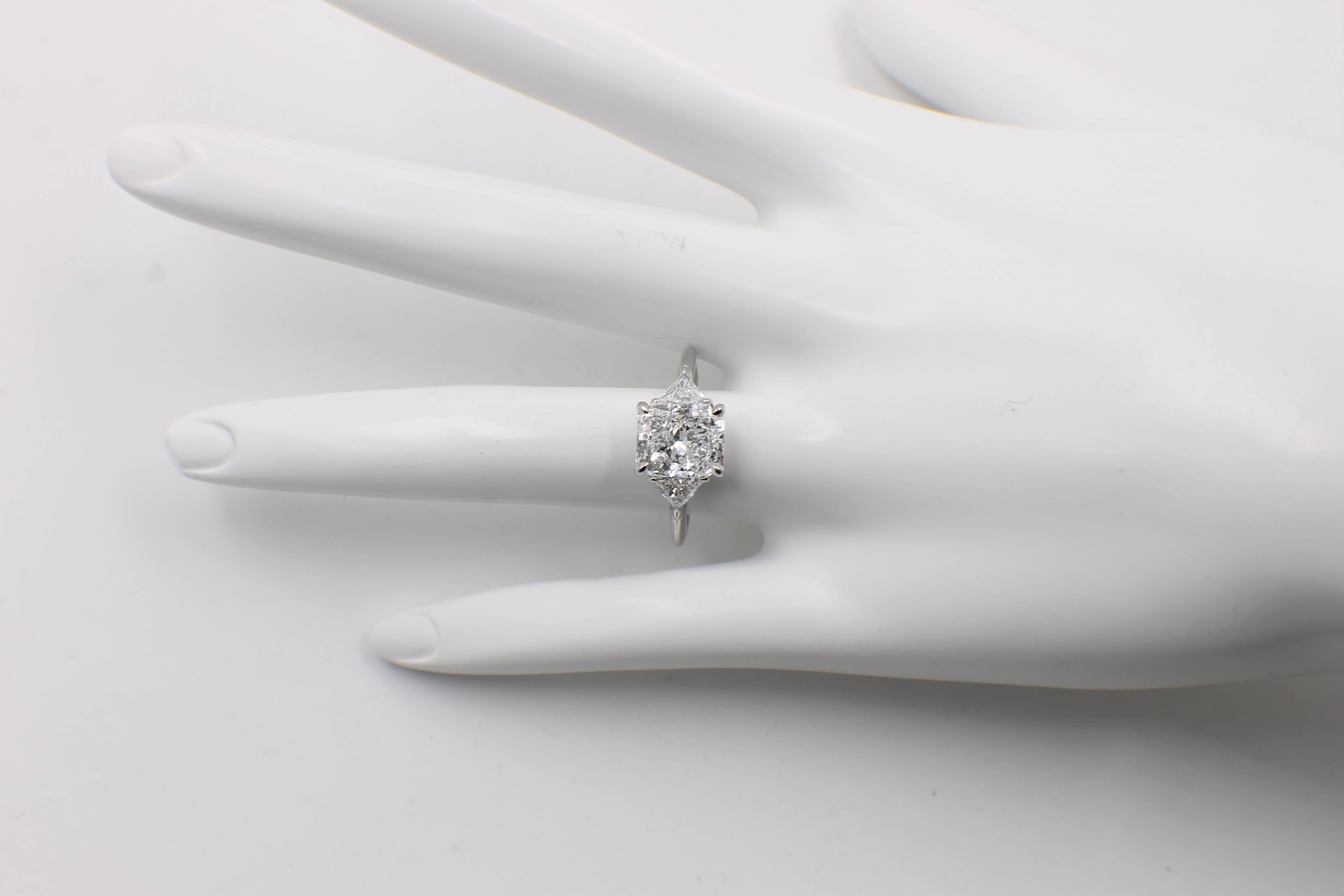 Tiffany & Co. Engagement Ring

Style:  3 Stone Diamond Engagement Ring  
Serial Number:  D27927 / GIA#10095579
Metal:  Platinum PT950
Size:   6 - sizable  
Total Carat Weight:  3.03 TCW
Diamond Shape:  Radiant Diamond 2.50 CTS
Diamond Color &