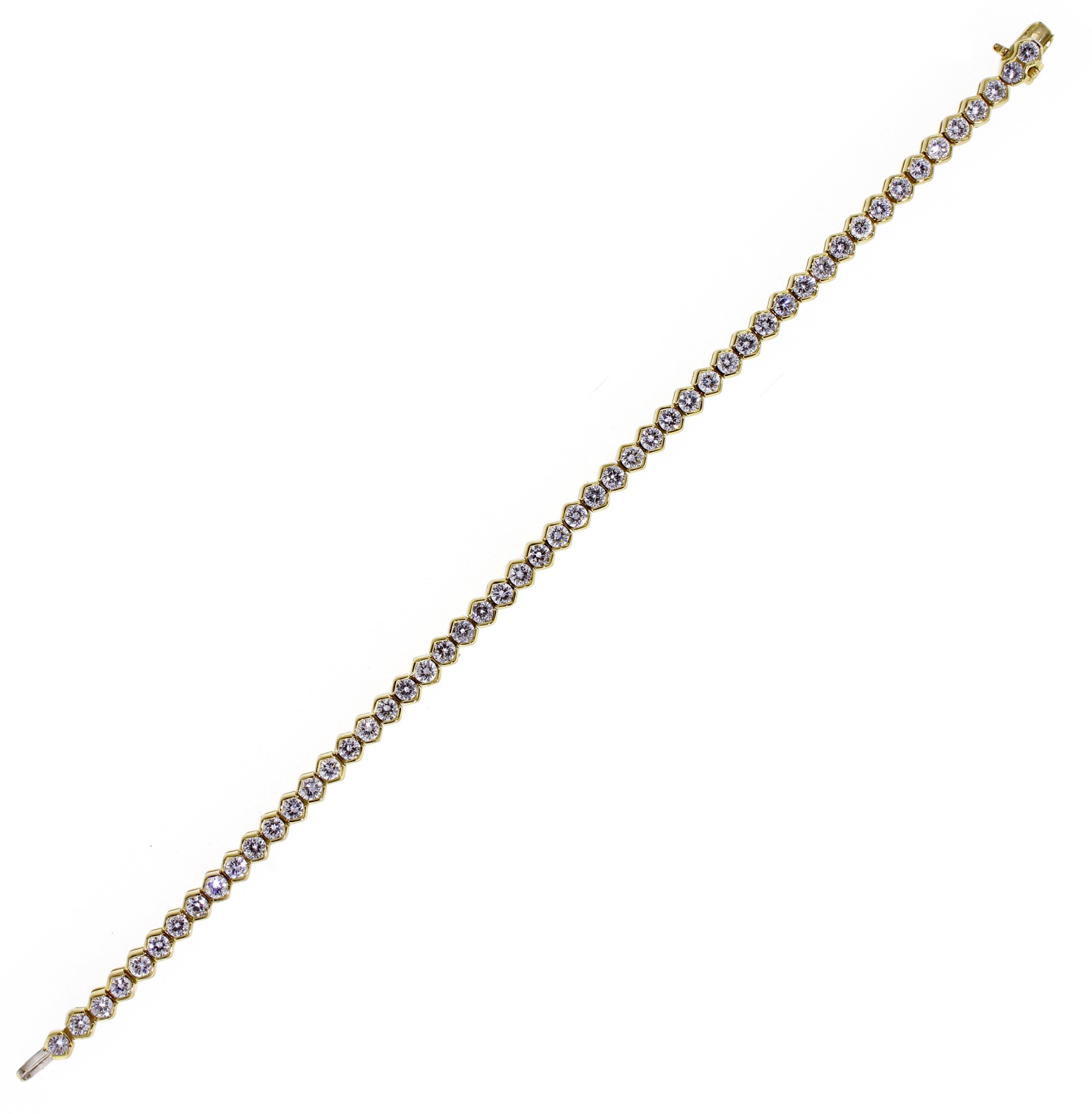 From Tiffany & Co., a stunning straight line diamond bracelet. The bracelet boasts 52 brilliant Tiffany diamonds weighing approximately 5 carats. The diamonds are G color and VVS clarity. 7 inches long