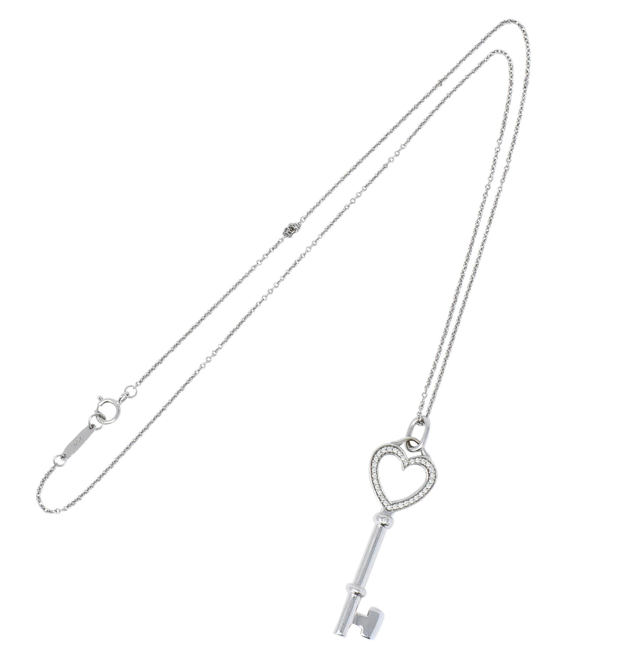 Thirty-three diamonds set in heart-shaped bow of key

Accented by single flush set diamond in key stem

Diamonds weigh approximately 0.05 carats total, eye-clean and white

Accompanied by 16 inch cable chain completed by spring ring clasp

Both