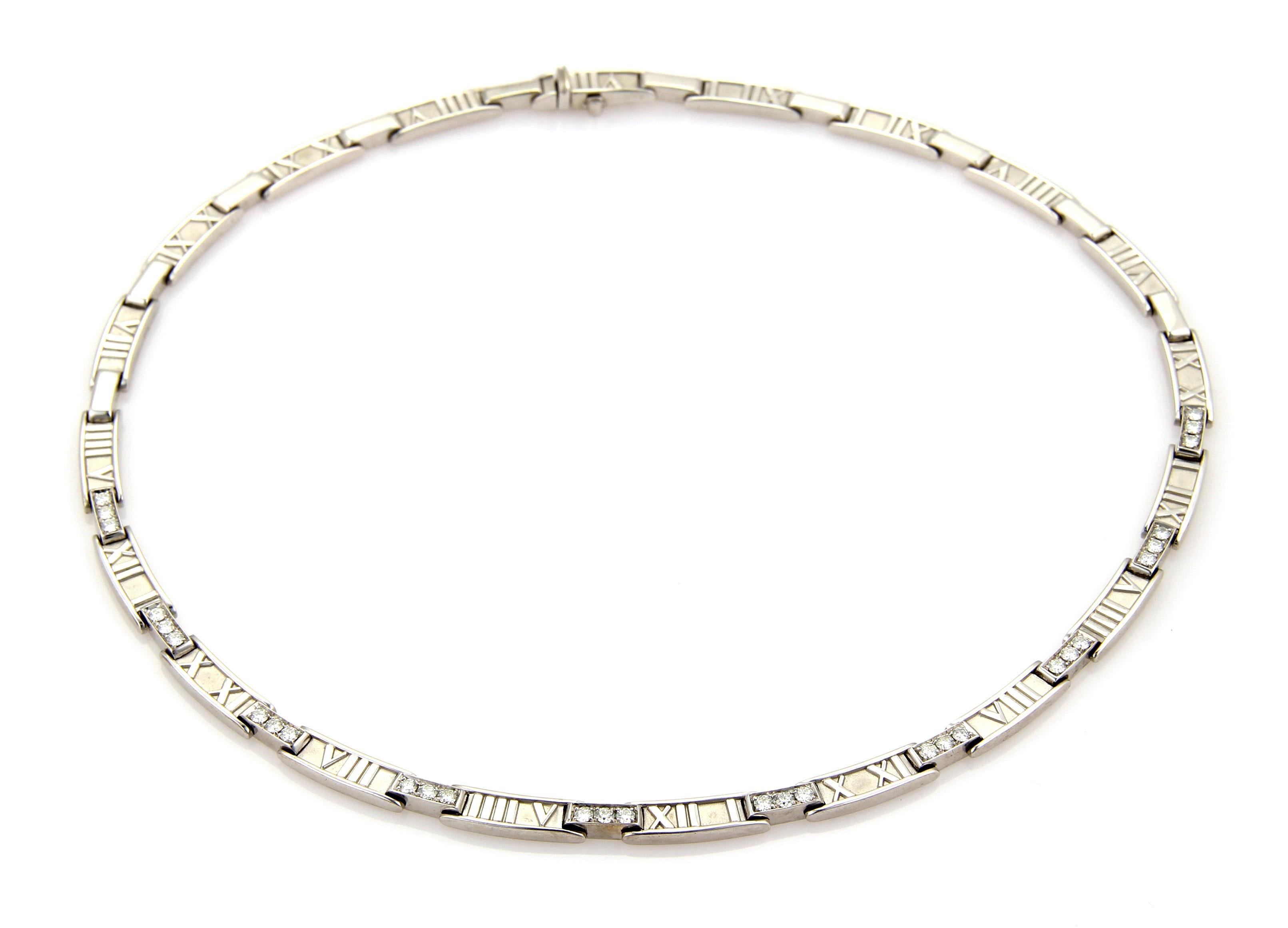 This is a gorgeous diamond necklace by Tiffany & Co. from the ATLAS collection.  It is crafted from solid 18k white gold with a polished and textured finish. The front half of the necklace is adorned with diamonds set in a bar link, the long