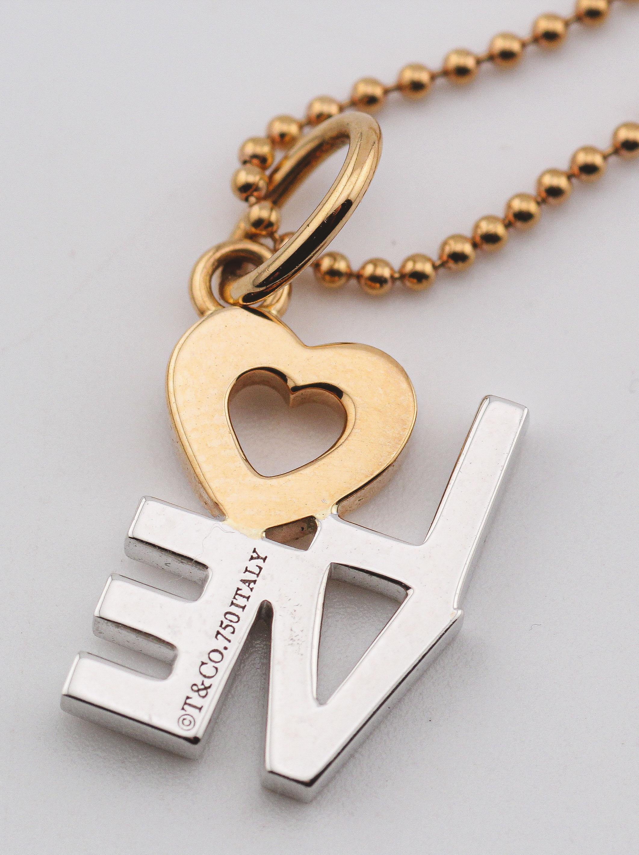 Tiffany & Co. Diamond 18K White Pink Gold Love Charm Pendant Necklace In Good Condition For Sale In Simpsonville, SC