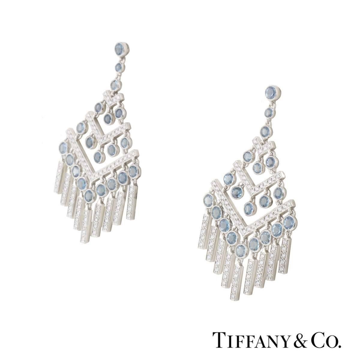 A beautiful pair of platinum diamond and aquamarine Tiffany & Co. chevron earrings from the Jazz collection. The earrings are comprised of a chandelier style with round brilliant cut diamonds and aquamarines placed alternatively in a vertical