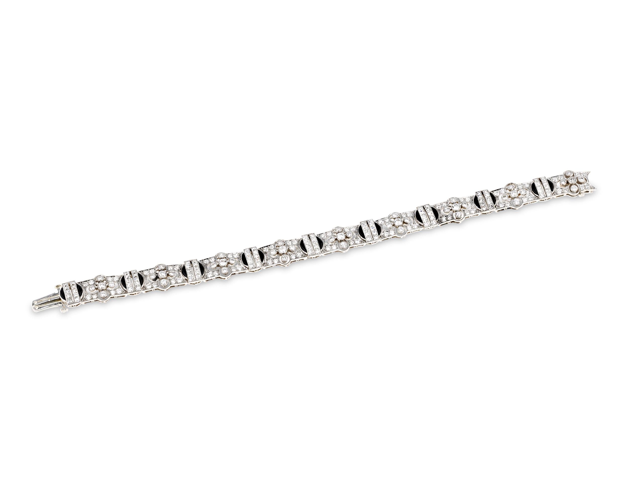 The American firm most synonymous with luxury, this Tiffany & Co. diamond and onyx bracelet perfectly illustrates why this firm is so beloved. Crafted in a sophisticated, streamlined Art Deco design, this bracelet sparkles with 6.33 total carats of