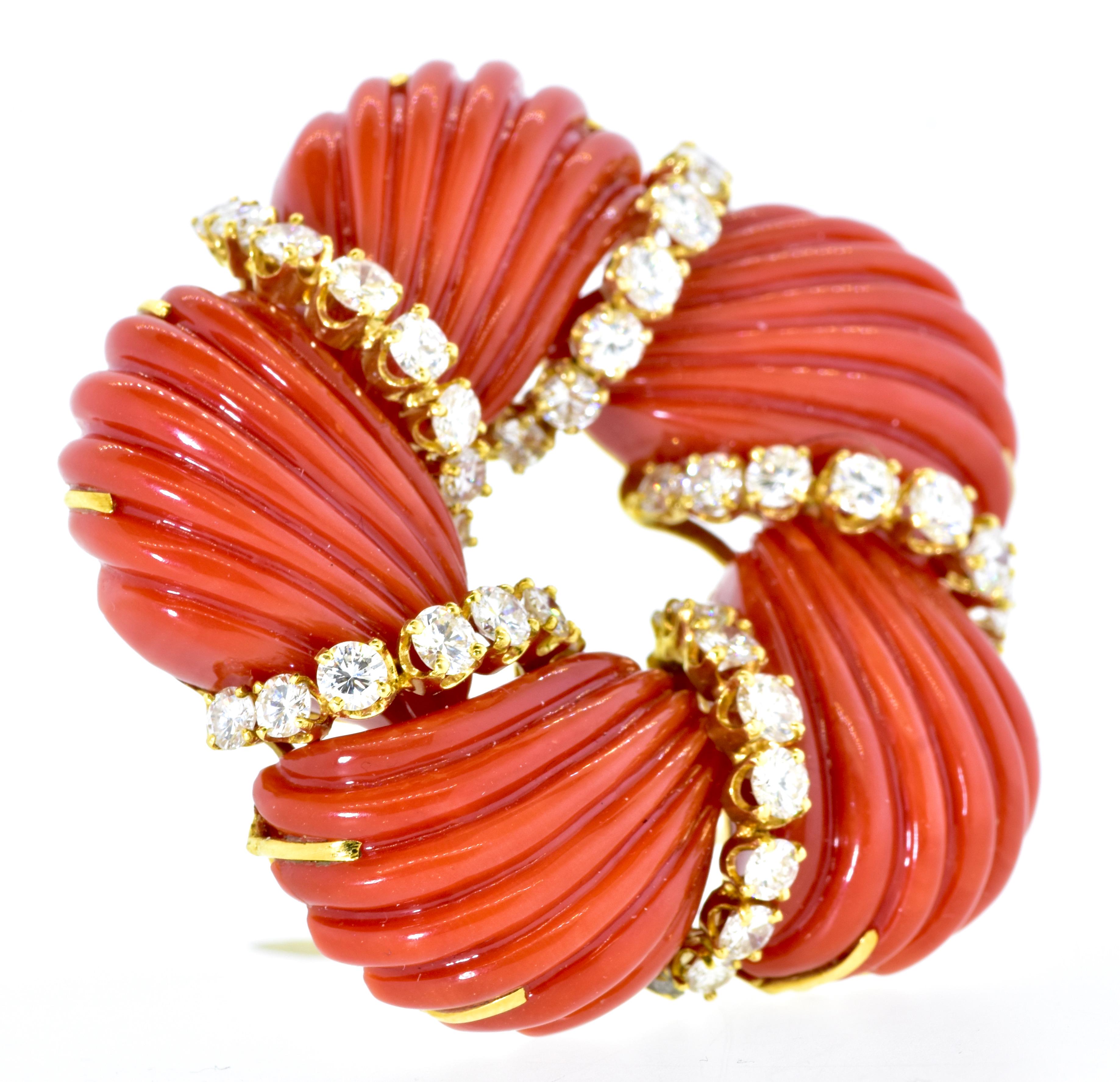 Tiffany & Company diamond and orange-red (oxblood) natural coral which has been hand cut and carved.  The white brilliant cut diamonds are as fine as one would expect from the famous American House of Tiffany & Co. - especially at this time when