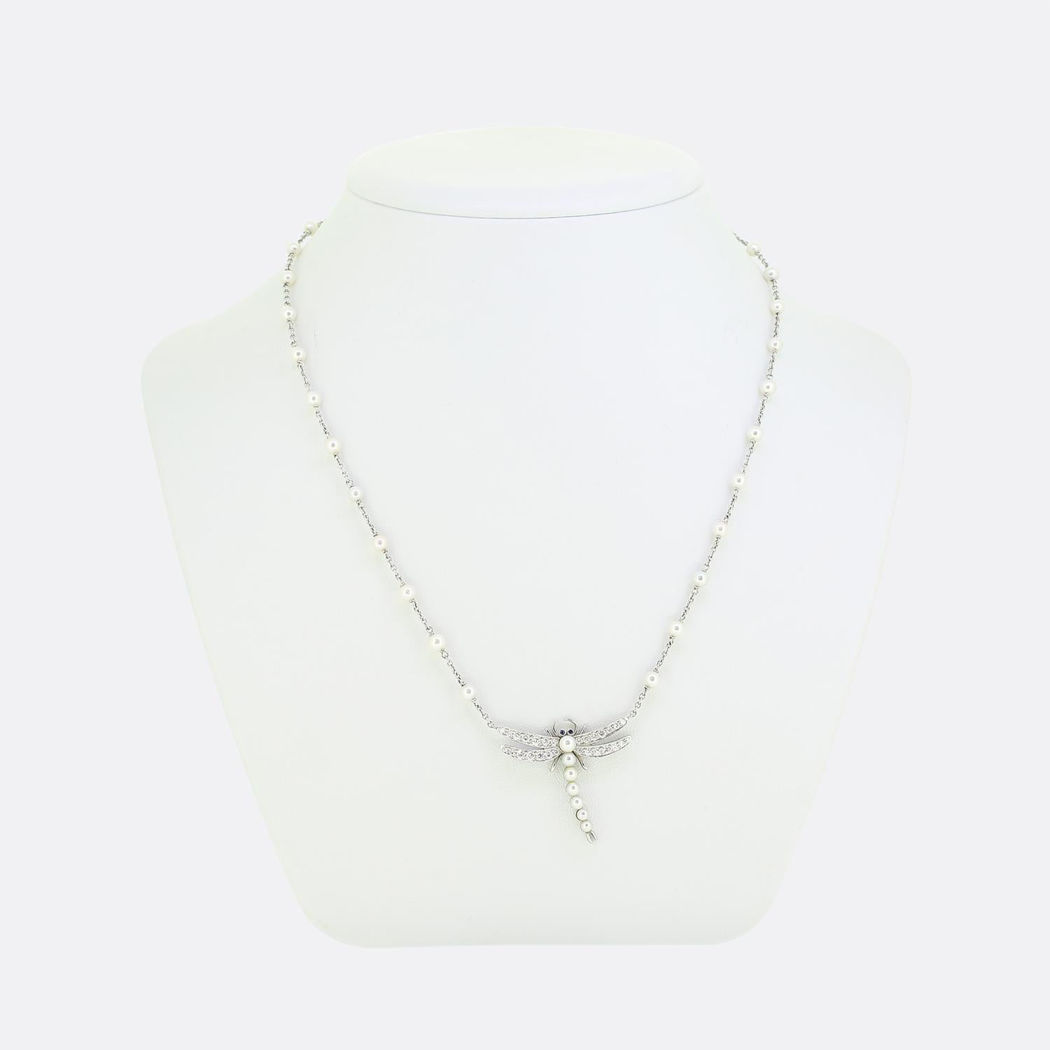 This is a beautiful and rare necklace from the luxury jewellery designer Tiffany & Co. The pendant is crafted in the form of a dragonfly and set with pearls as the body, diamond set wings and blue sapphire eyes. The dragonfly and chain are crafted