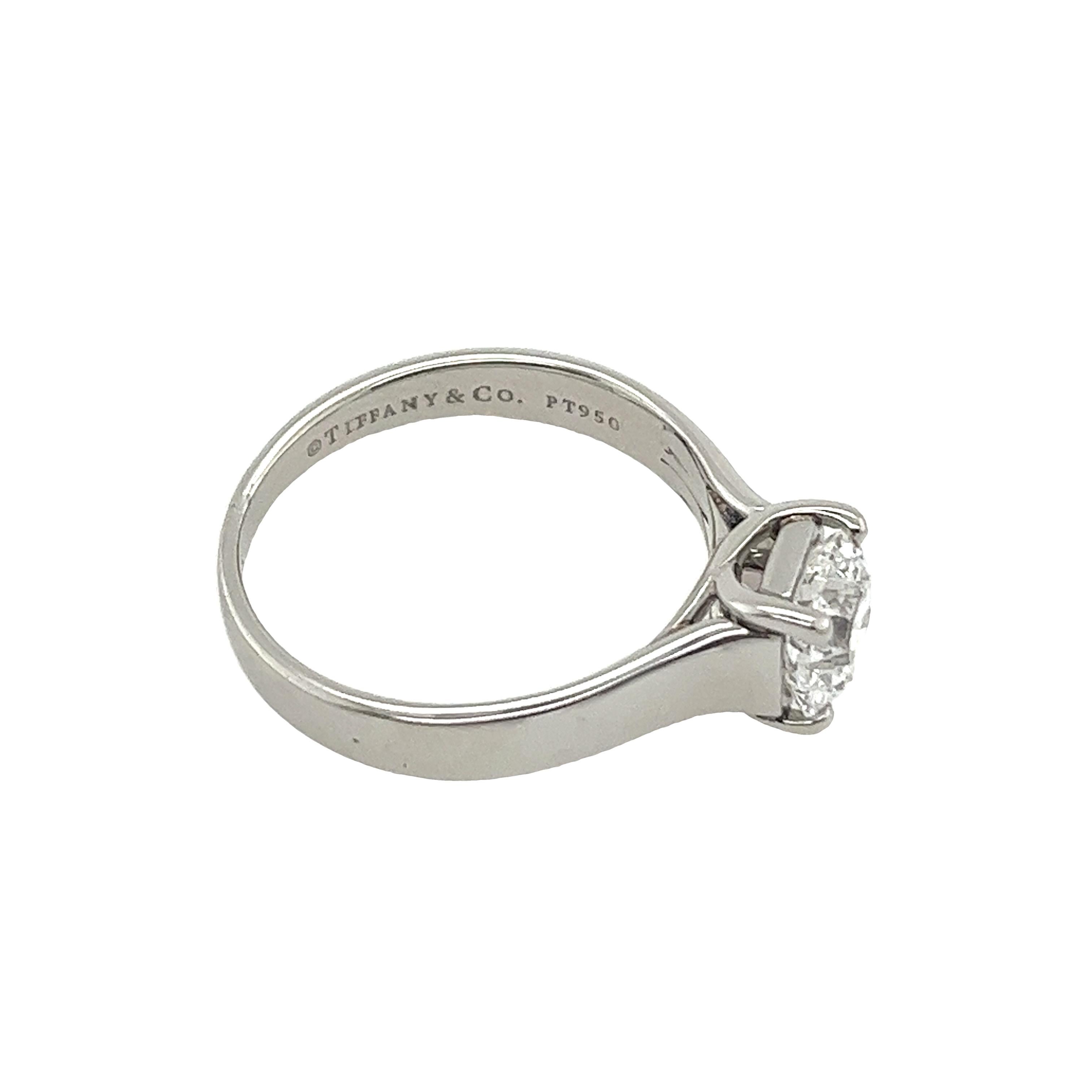 Radiating timeless sophistication, the Tiffany & Co. Diamond and Platinum Classic Solitaire Engagement Ring features a magnificent 1.14ct E/VS1 cut cornered square diamond. Set in platinum, its classic design exudes elegance, symbolizing eternal