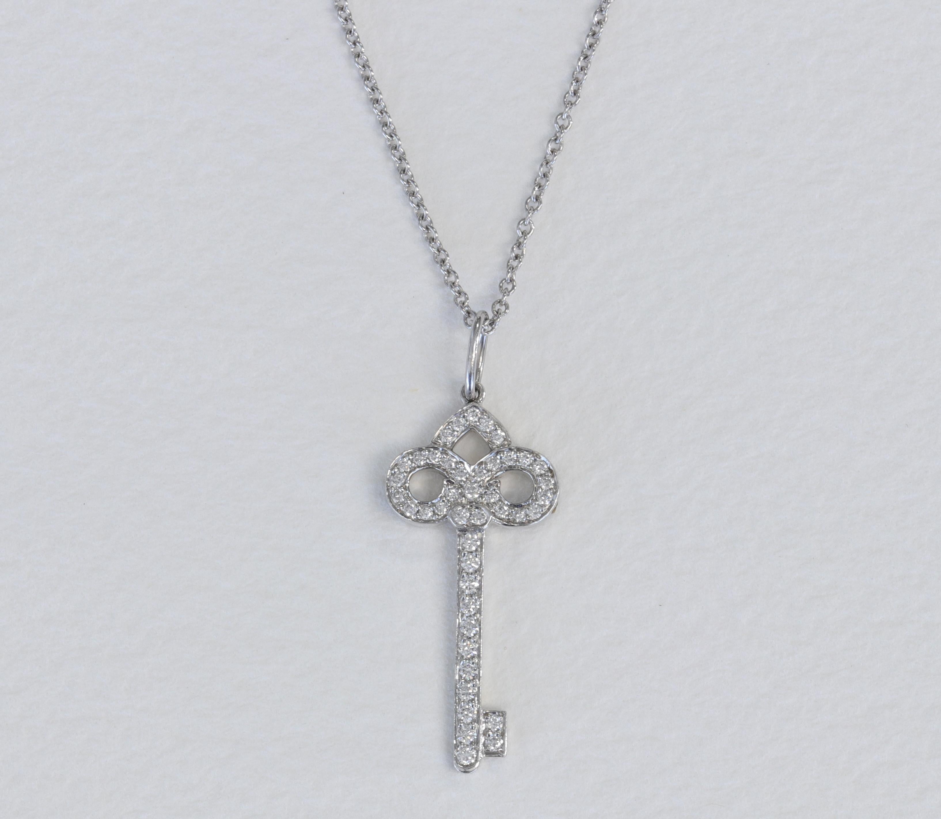 Tiffany & Co. Diamond and Platinum Small Key Pendant and Necklace 

16 inch length platinum Tiffany Co chain.