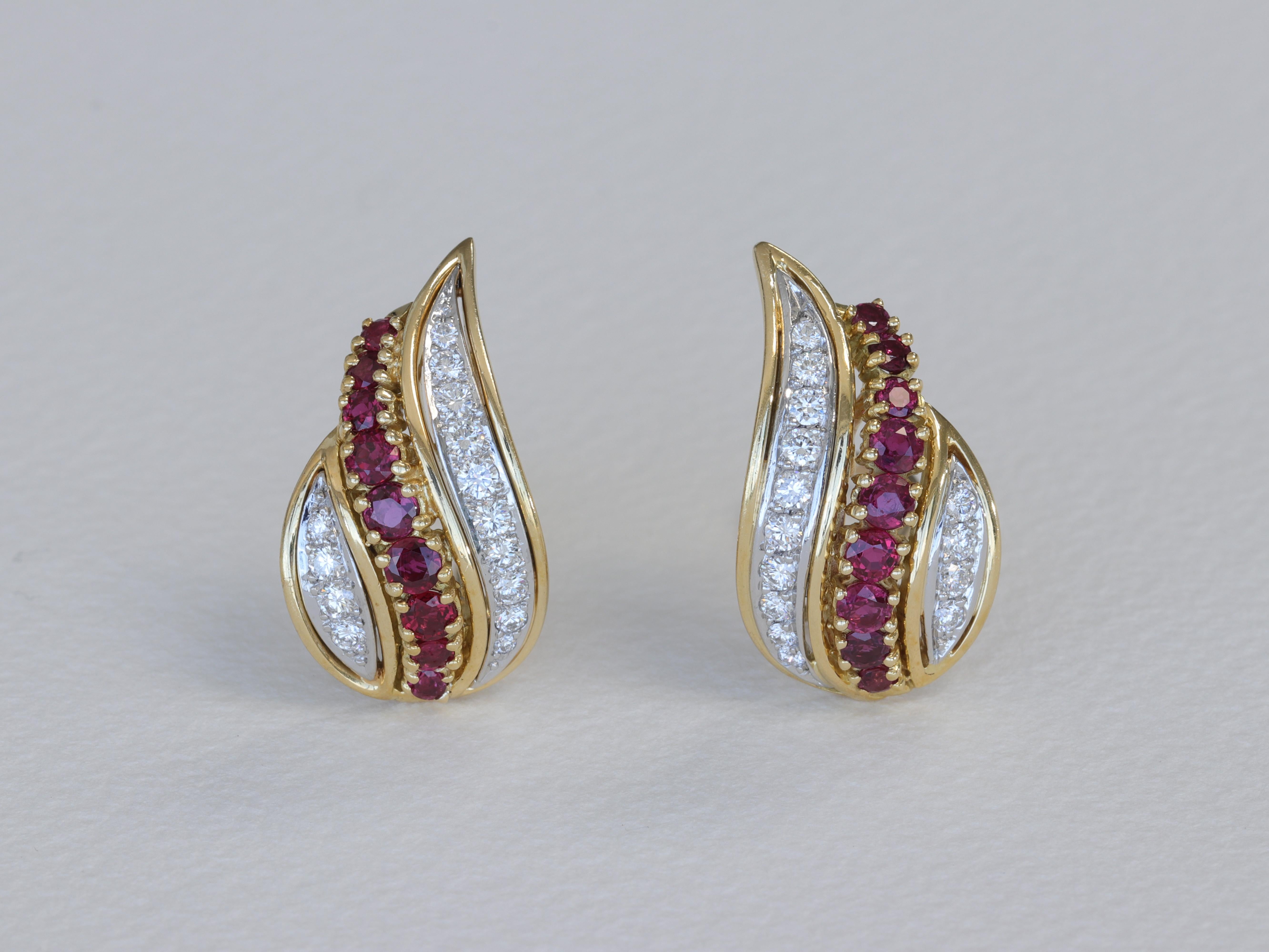 A special pair of Tiffany & Co. paisley motif round cut diamond and ruby earrings set in 18 karat yellow gold and platinum with lever back posts. 

The diamonds weigh in total approximately 1.50 carats, with colors of D-G and clarities of