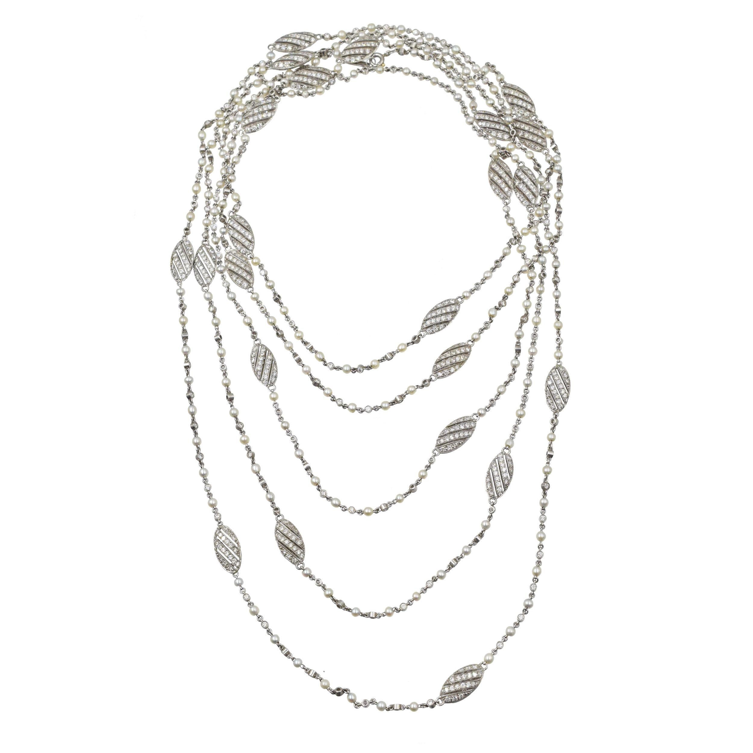 Tiffany & Co. Diamond And Seed Pearl Long Chain In Platinum. 
This necklace consists of 184 seed pearls alternating with 184 round brilliant cut diamonds bezel set in platinum, accented with 23 equally spaced diamond encrusted dividers. There is