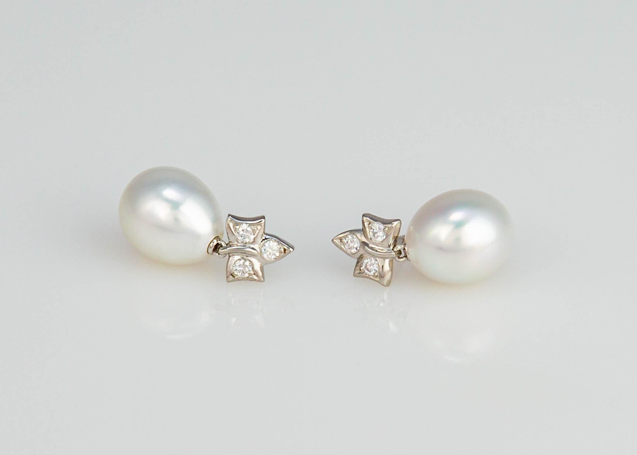 Playful, chic, sassy. Tiffany & Co. created a do everything pearl and diamond earring. Platinum, diamond and beautiful South Sea pearls are a classic combination. At just 7/8's of an inch they will go everywhere. The pearls measure 13.3mm X 11.3mm