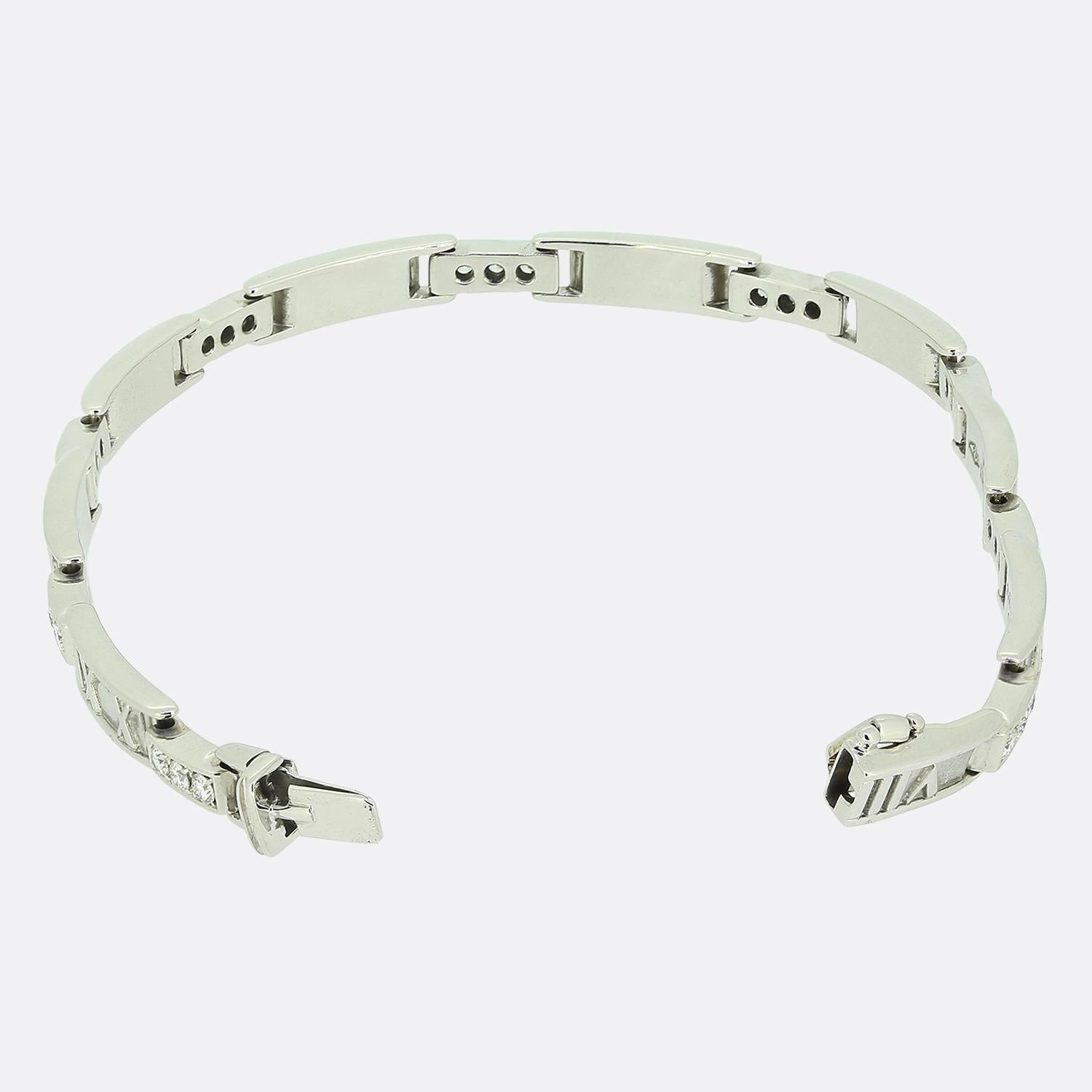 Here we have an elegant diamond bracelet from the world renowned luxury jewellery designer, Tiffany & Co. This articulated piece forms part of their Atlas collection and has been crafted from 18ct white gold. It is composed of a series of