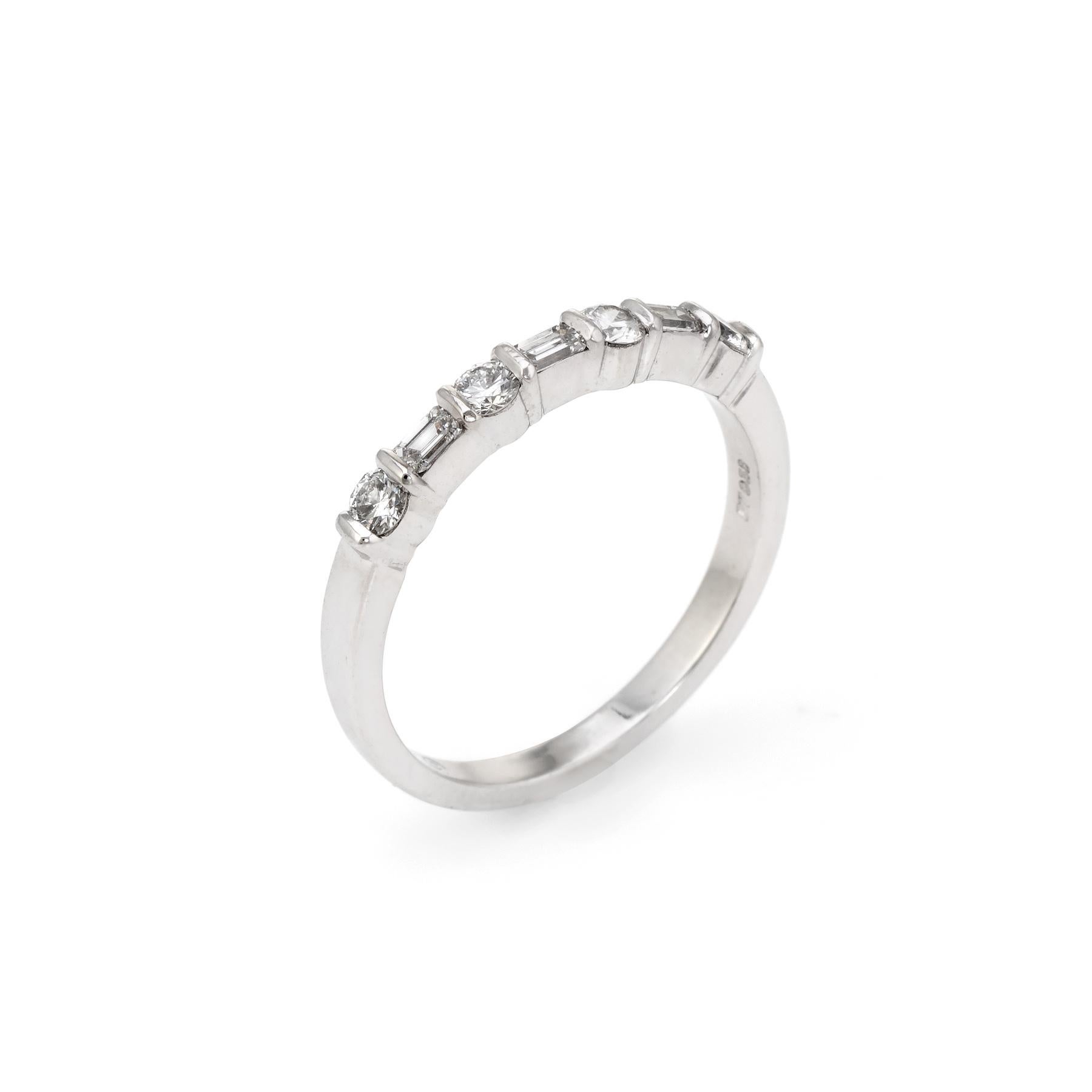 Pre-owned Tiffany & Co mixed cut diamond band crafted in platinum.  

Four round brilliant cut diamonds are estimated at 0.08 carats, with three emerald cut diamonds estimated at 0.05 carats each. The total diamond weight is estimated at 0.47 carats