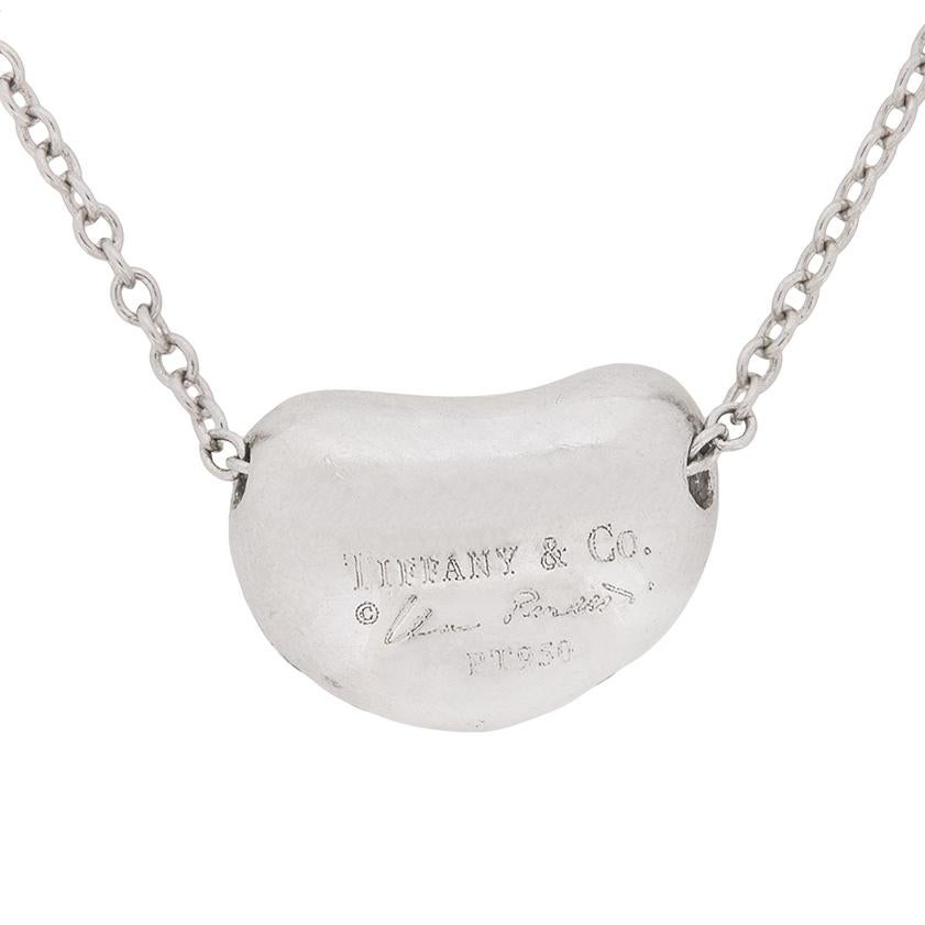 This is a beautiful and unique little pendant from Tiffany & co. It has since been discontinued, which adds to it's rarity. It is a 'Bean' shape, studded diamonds which have a total weight of 0.38 carat and a grading of F colour and VS clarity. The