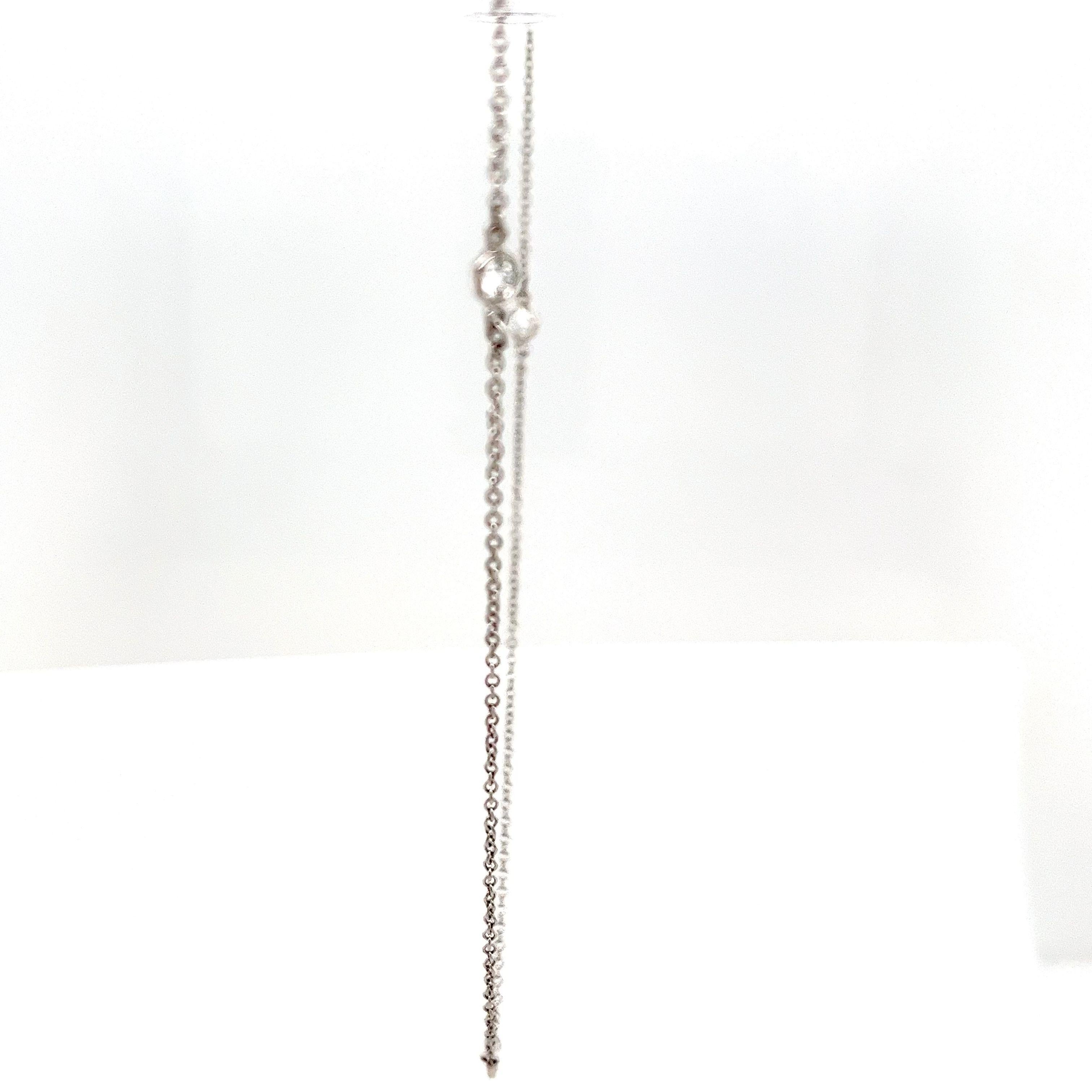 The Tiffany & Co. Diamond by the Yard necklace is a classic piece! With 5 diamonds totaling 0.30 carats, it's elegant and versatile.  This necklace features a simple yet sophisticated design with diamonds set at intervals along the chain, allowing
