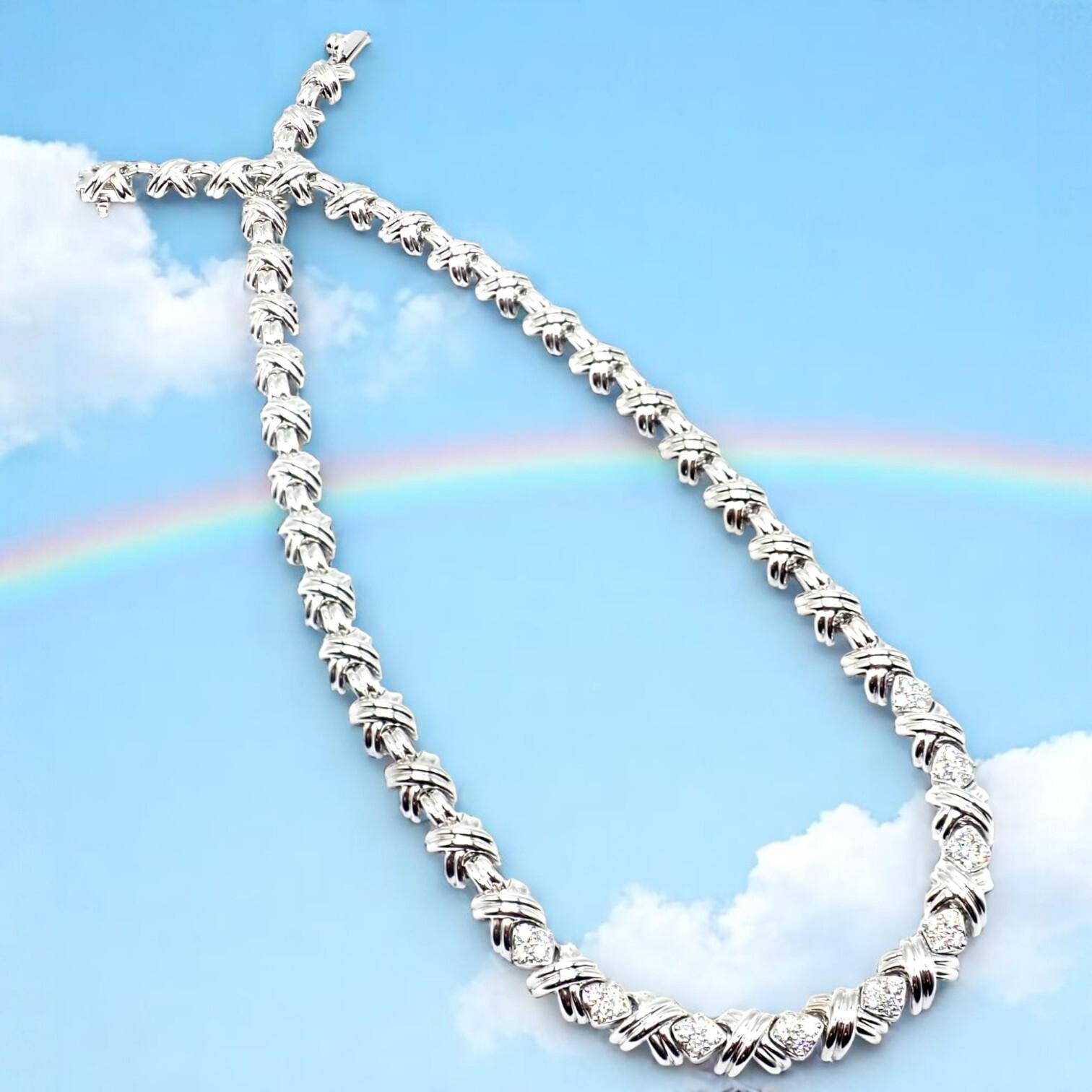 18k White Gold Diamond Cluster Signature X White Gold Link Necklace by Tiffany & Co. 
This Tiffany & Co. Signature X Link necklace is crafted in radiant 18k white gold, featuring a series of bold “X” motifs accented with dazzling diamond clusters.