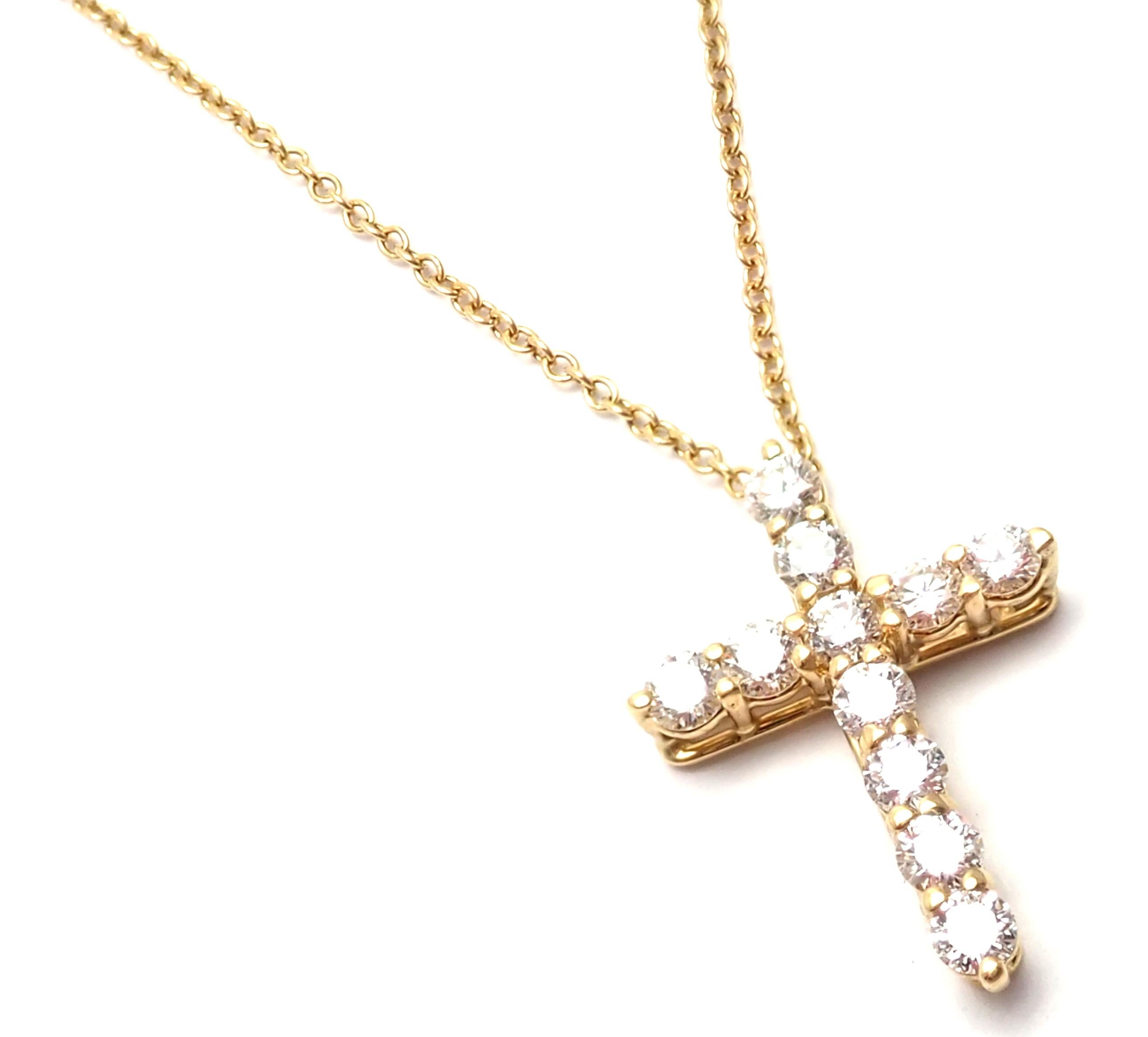 18k Yellow Gold Diamond Cross Pendant Necklace by Tiffany & Co.
With 11 Round brilliant cut diamonds VS1 clarity, E color total weight approx. .42ct
Details:
Length: 20