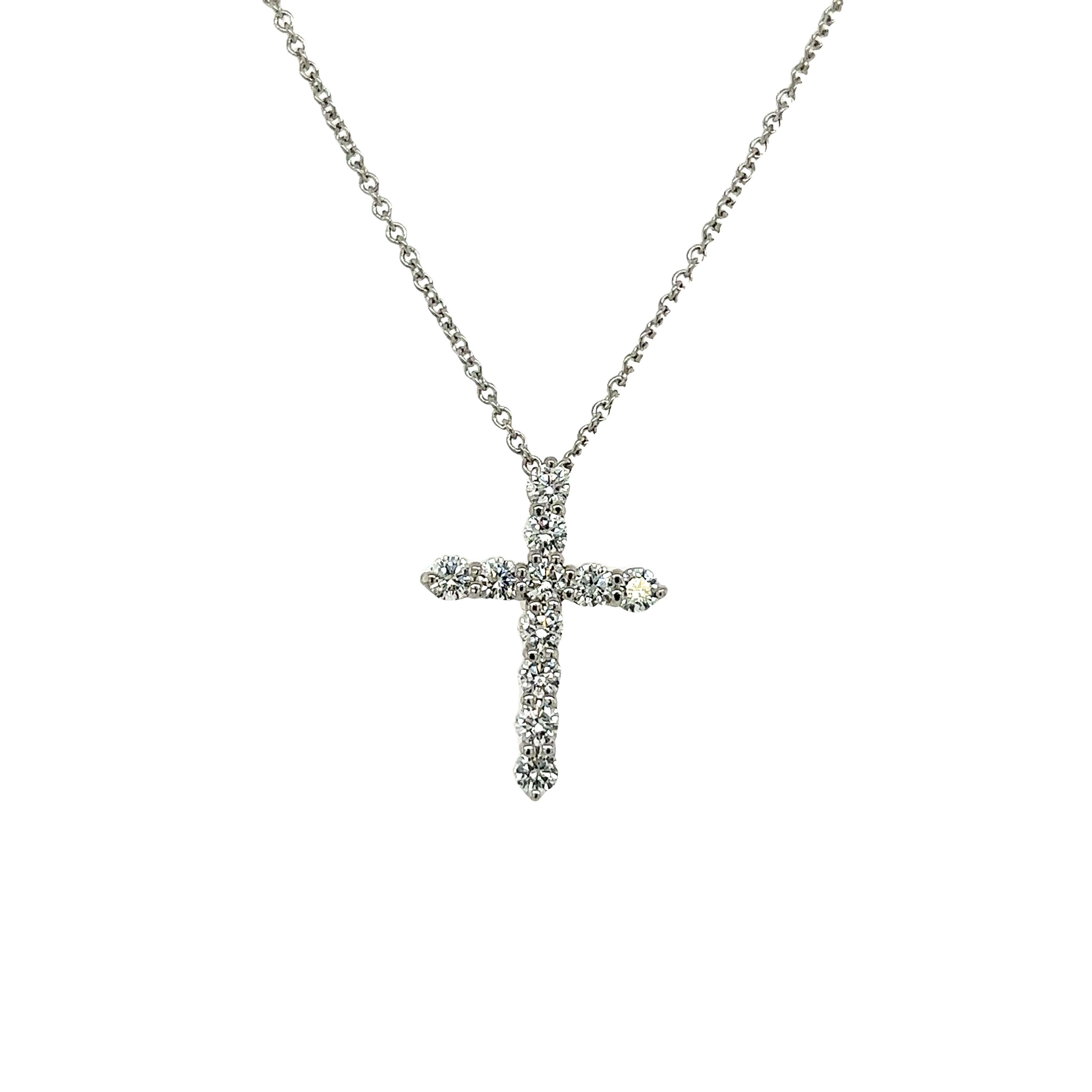 Erhöhen Sie Ihren Stil mit der zeitlosen Eleganz der Tiffany & Co. Diamant-Kreuz-Anhänger. Dieses exquisite Stück ist aus den besten Materialien gefertigt und zeigt ein klassisches Kreuzdesign, das mit funkelnden runden Diamanten im Brillantschliff