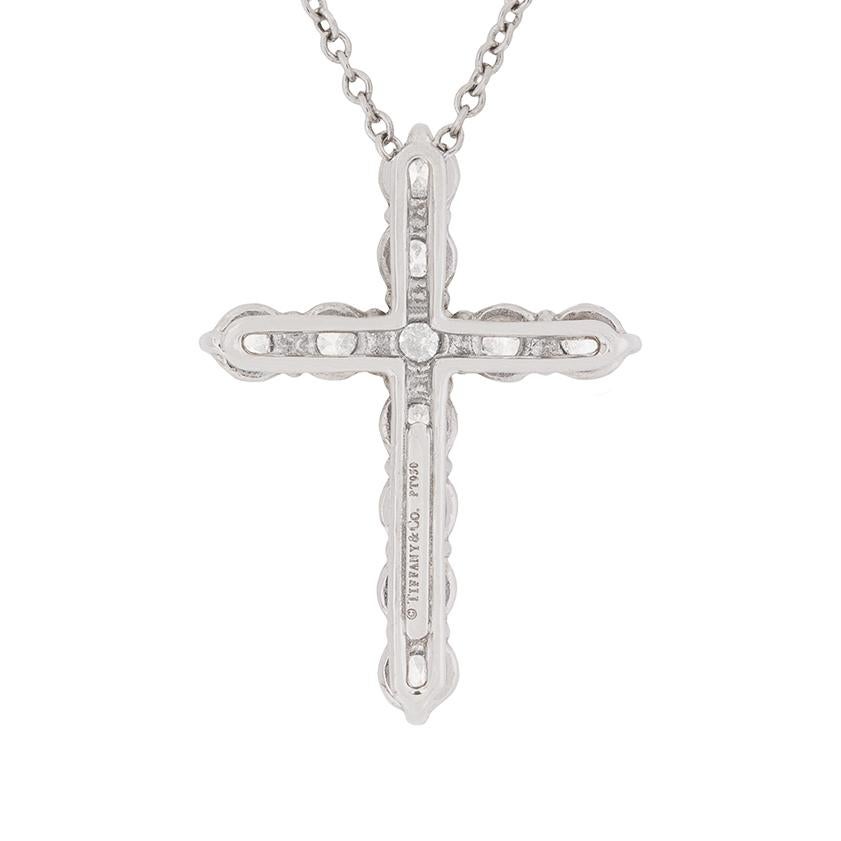 Renowned designer Tiffany & Co diamond cross pendant. It has a total of 0.90 carat and they are of impeccable quality. They are F in colour and VVS2 in clarity set within a shared claw setting allowing them to truly sparkle. There are 11 diamonds