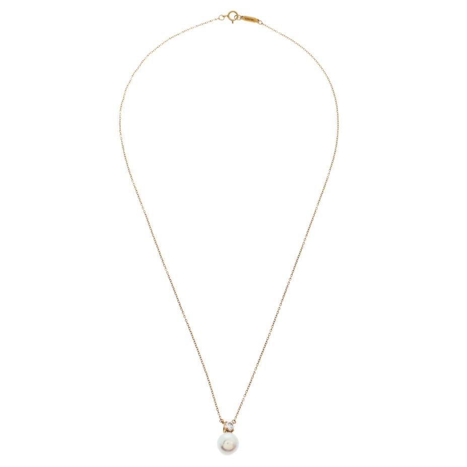 There is nothing more elegant and ladylike than a classic pearl necklace. This Tiffany & Co. necklace features an 18K yellow gold chain that holds a petite diamond in a four prong setting and a lovely cultured pearl pendant. This can be a great gift