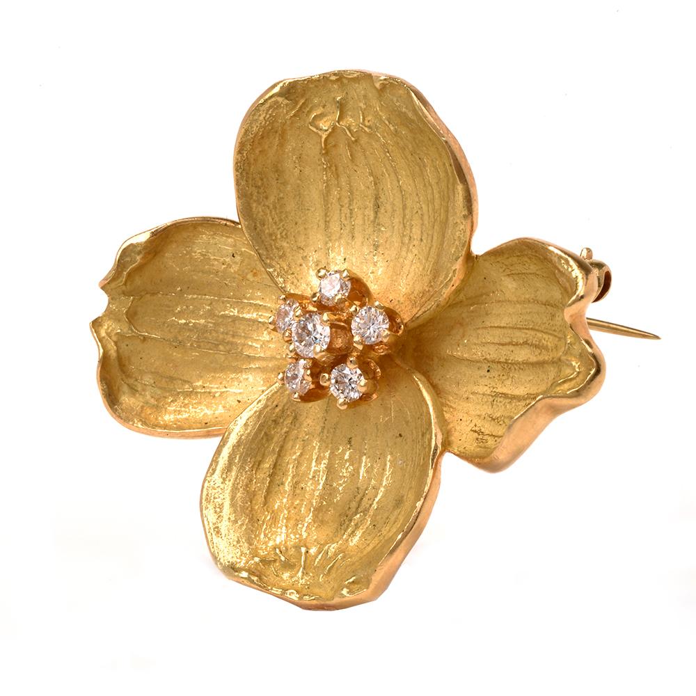  This beautiful and authentic Dogwood flower brooch is crafted by Tiffany & Co. in solid yellow gold, weighing 15.6 grams and measuring 33mm long x 36mm wide. Centered with 6 prong-set round-cut diamonds, collectively weighing approximately, 0.35