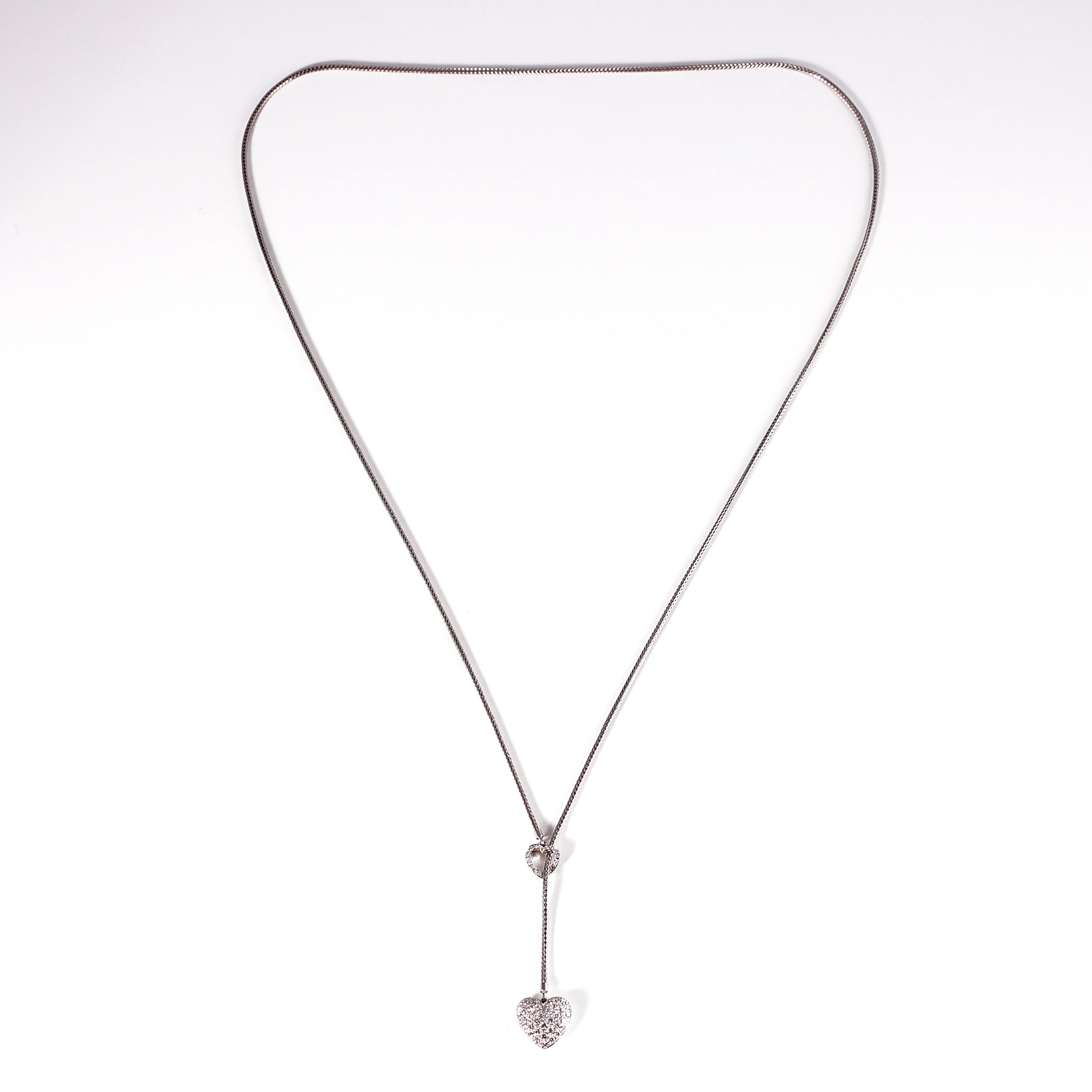 Tiffany & Co. 0.78 carat double diamond heart lariat necklace set in Platinum.  This necklace is 27 inches long and can can be adjusted to go with any ensemble!  It is stamped 