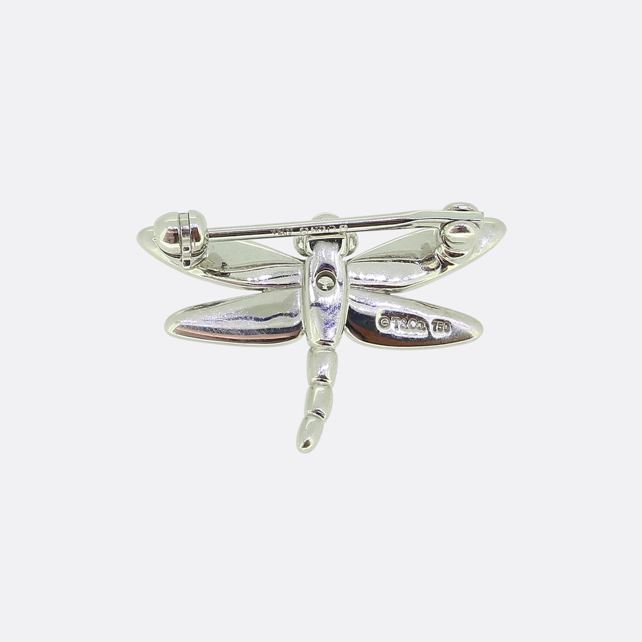 Here we have an 18ct white gold brooch from the world renowned jewellery designer, Tiffany & Co. This piece has been crafted into the shape of a dragonfly with the design featuring smooth, elongated wings and a segmented body, capturing the essence