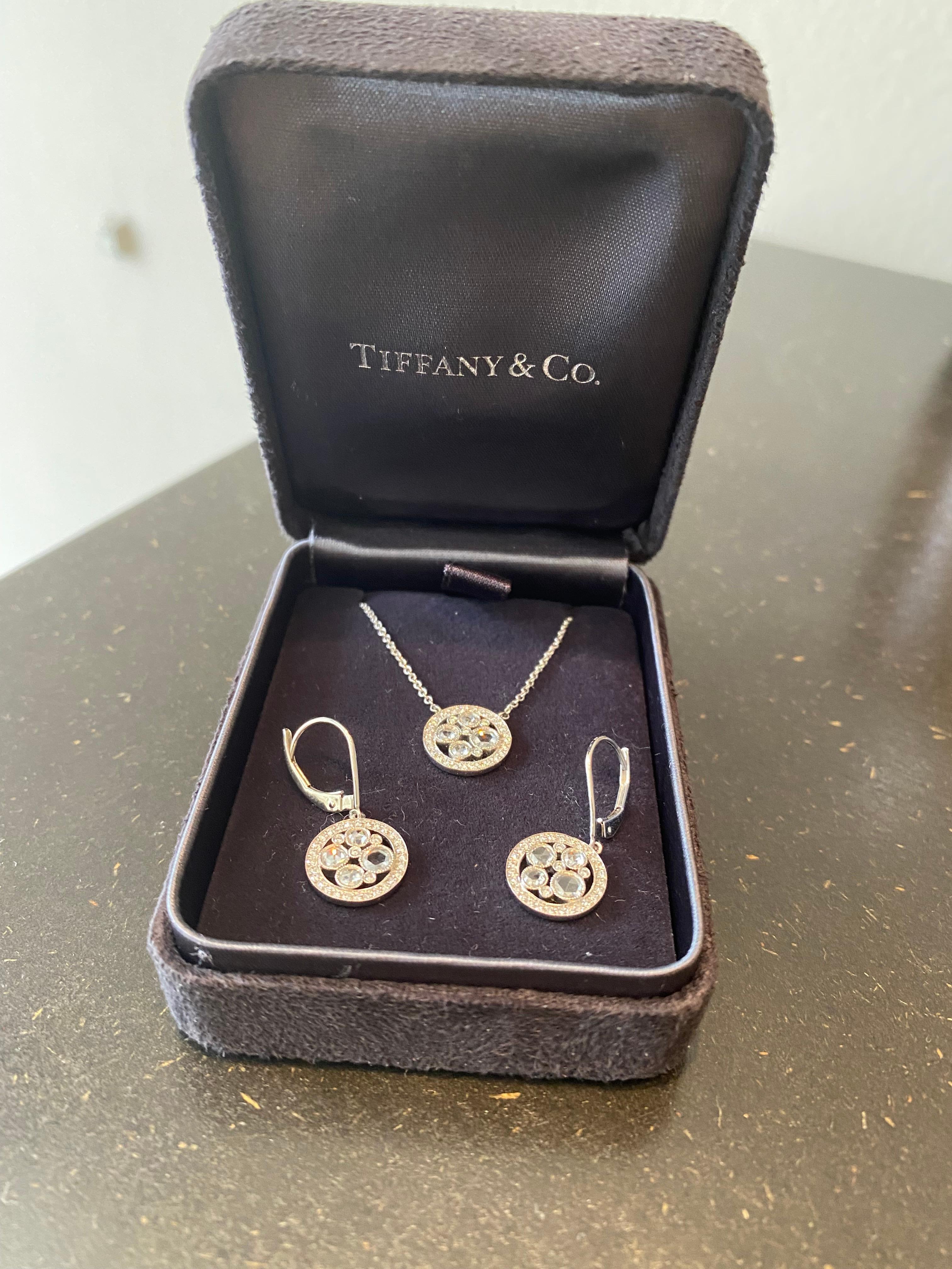 A charming set of platinum earrings and necklace by Tiffany & Co. 
The iconic jewelry House delights customers with its exquisite craftsmanship and elegance of each piece nearly for two centuries. This gentle ensemble is a perfect example of its