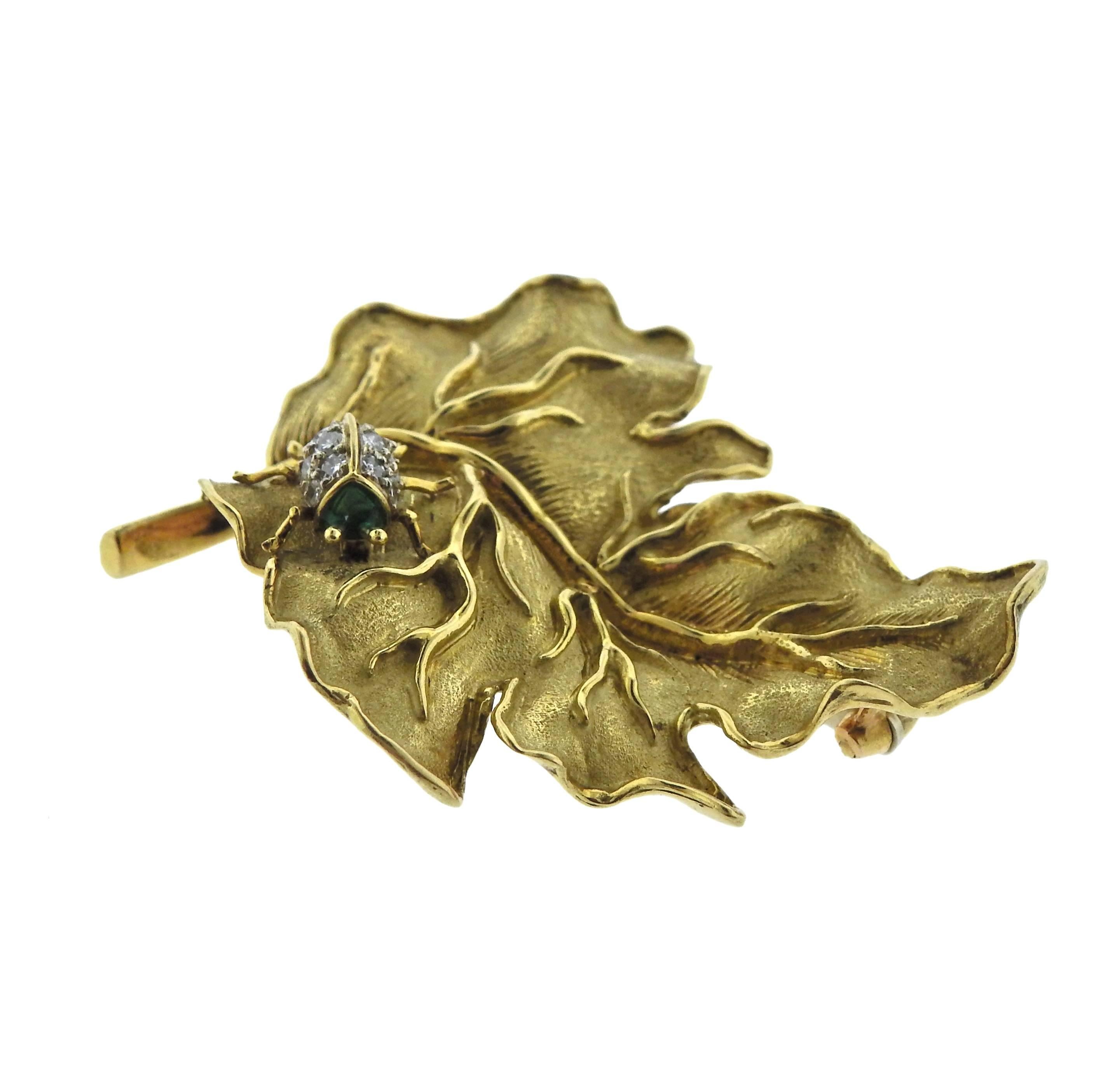 Whimsical 18k gold leaf brooch depicting a lady bug, crafted by Tiffany & Co. Features approximately 0.10ctw of G/VS diamonds and emerald. Brooch is 49mm x 39mm, weight is 17.1 grams. Marked k18, Italy, Tiffany & Co. 