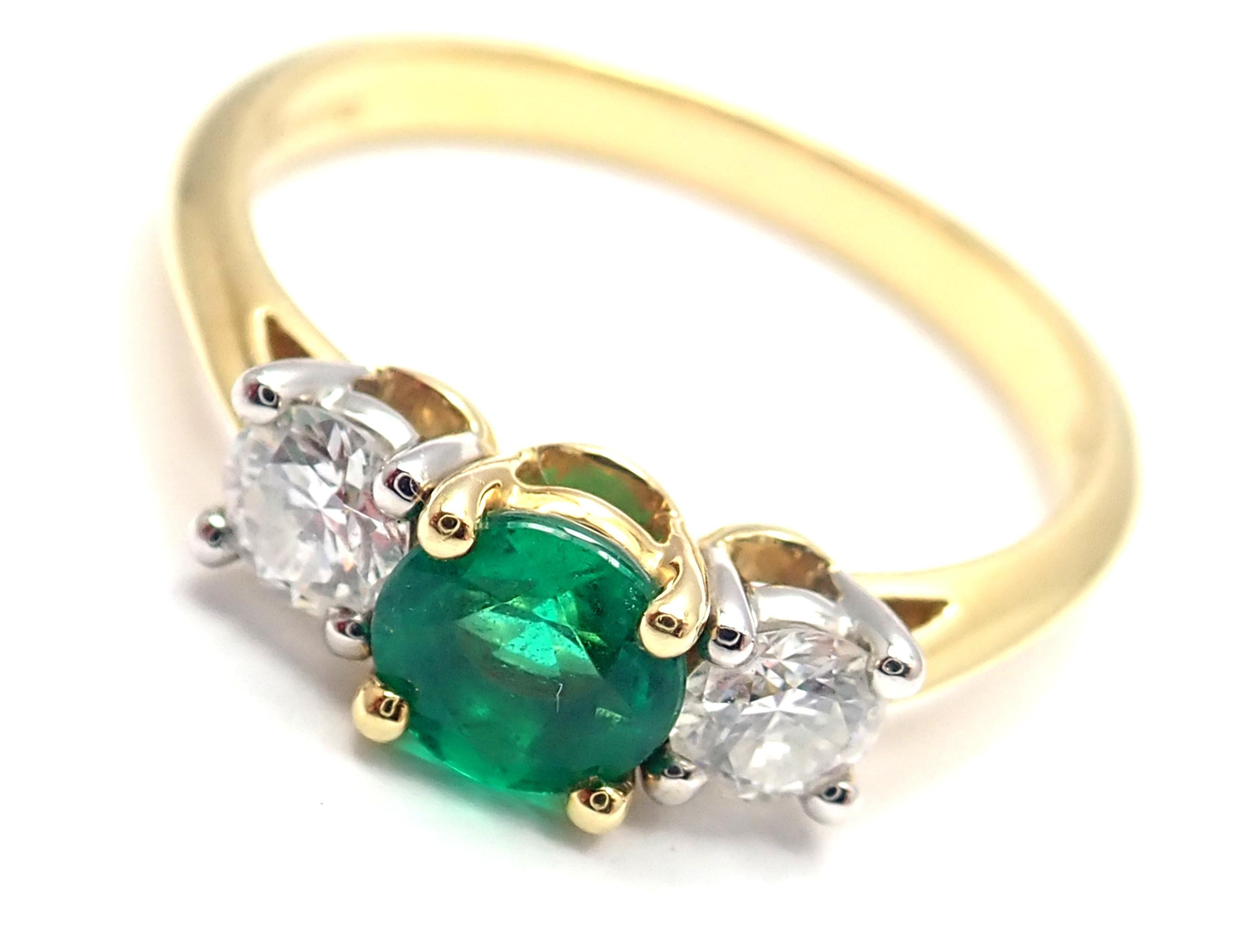 18k Yellow Gold And Platinum Diamond Emerald Three Stone Band Ring.
With 2 round brilliant cut diamonds VS1 clarity, G color total weight approx. .36ct
1 round emerald total weight approx. .50ct
Measurements:
Ring Size: 7
Weight:  3.4 grams
Width at