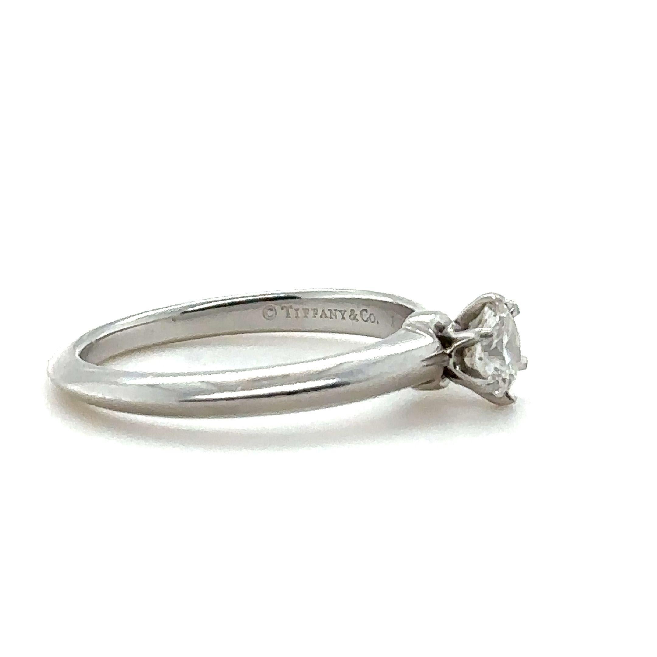 Tiffany & Co. Diamond Engagement ring, made of 950 Platinum, and weighing 5.4 grams.

Set with a Round, brilliant cut Diamond, colour H, and clarity VVS2. Weighing 0.52 ct. Laser inscribed: T&Co K01200168.

Metal: Platinum PT950
Carat:
