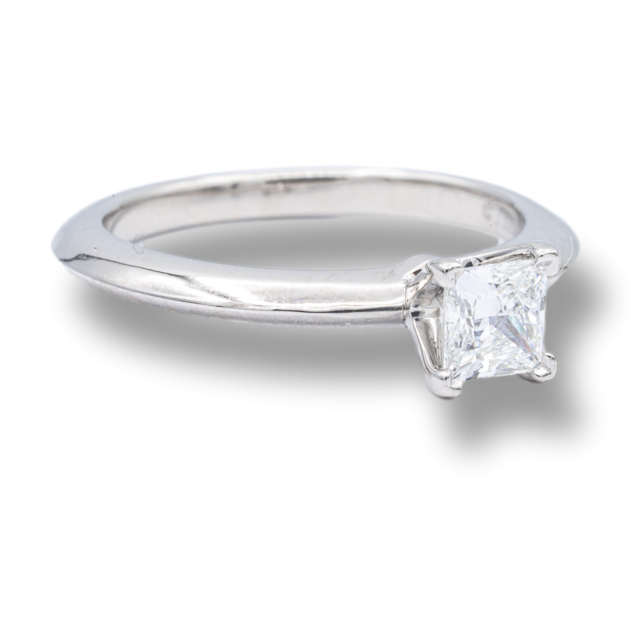 Tiffany & Co. Diamond Engagement ring with Tiffany & Co. Hallmark, featuring a princess cut 0.38 ct Center, graded G color , and VS1 Clarity, in Platinum.    This diamond Includes a GIA certificate with report number 2213855906 and a grading of G