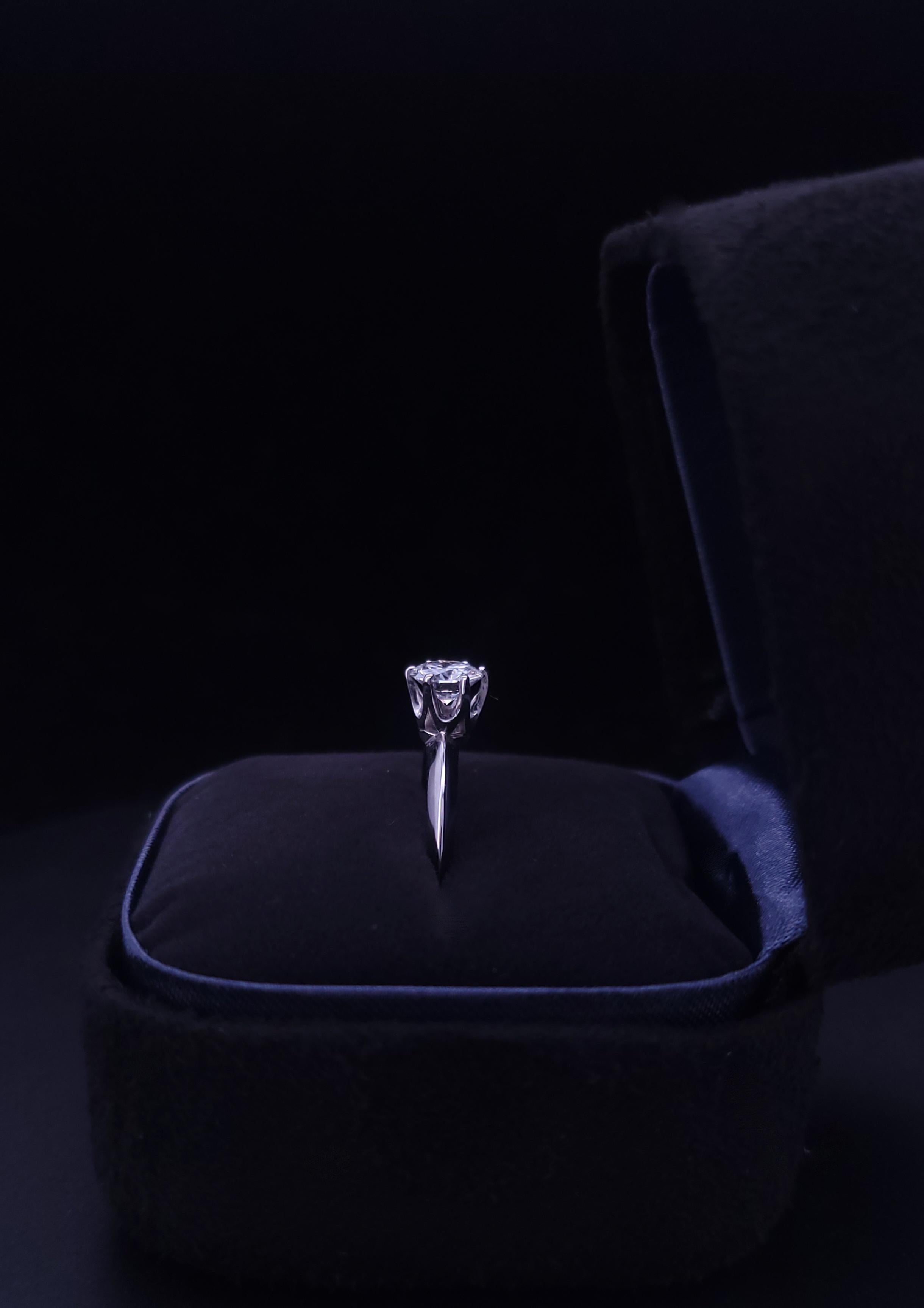 Brand Tiffany & Co
Material: Platinum
Condition: Pre-Owned

Diamond: 0.65ctw
Clarity: VVS
Color: E
Ring Size: 4.75

Comes with Tiffany Box
Retail Price: $5900.00