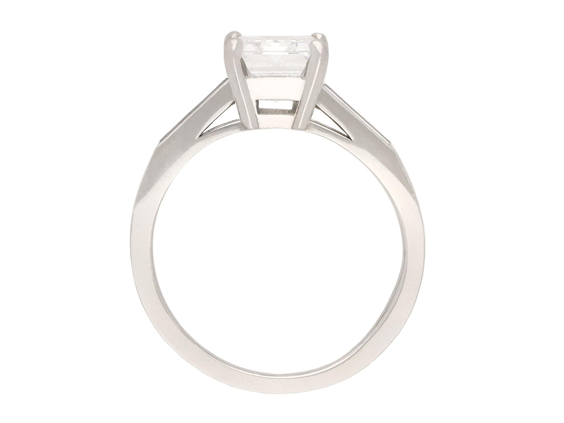 Emerald Cut Tiffany & Co. diamond flanked solitaire ring, circa 1950. For Sale