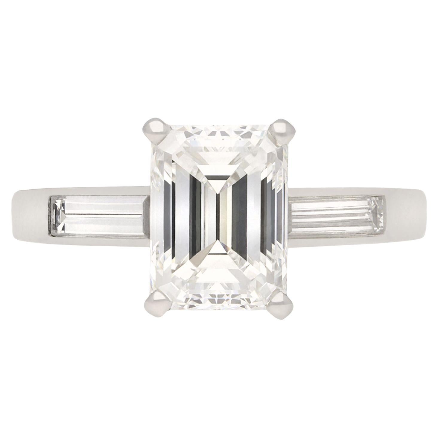 Tiffany & Co. diamond flanked solitaire ring, circa 1950. For Sale