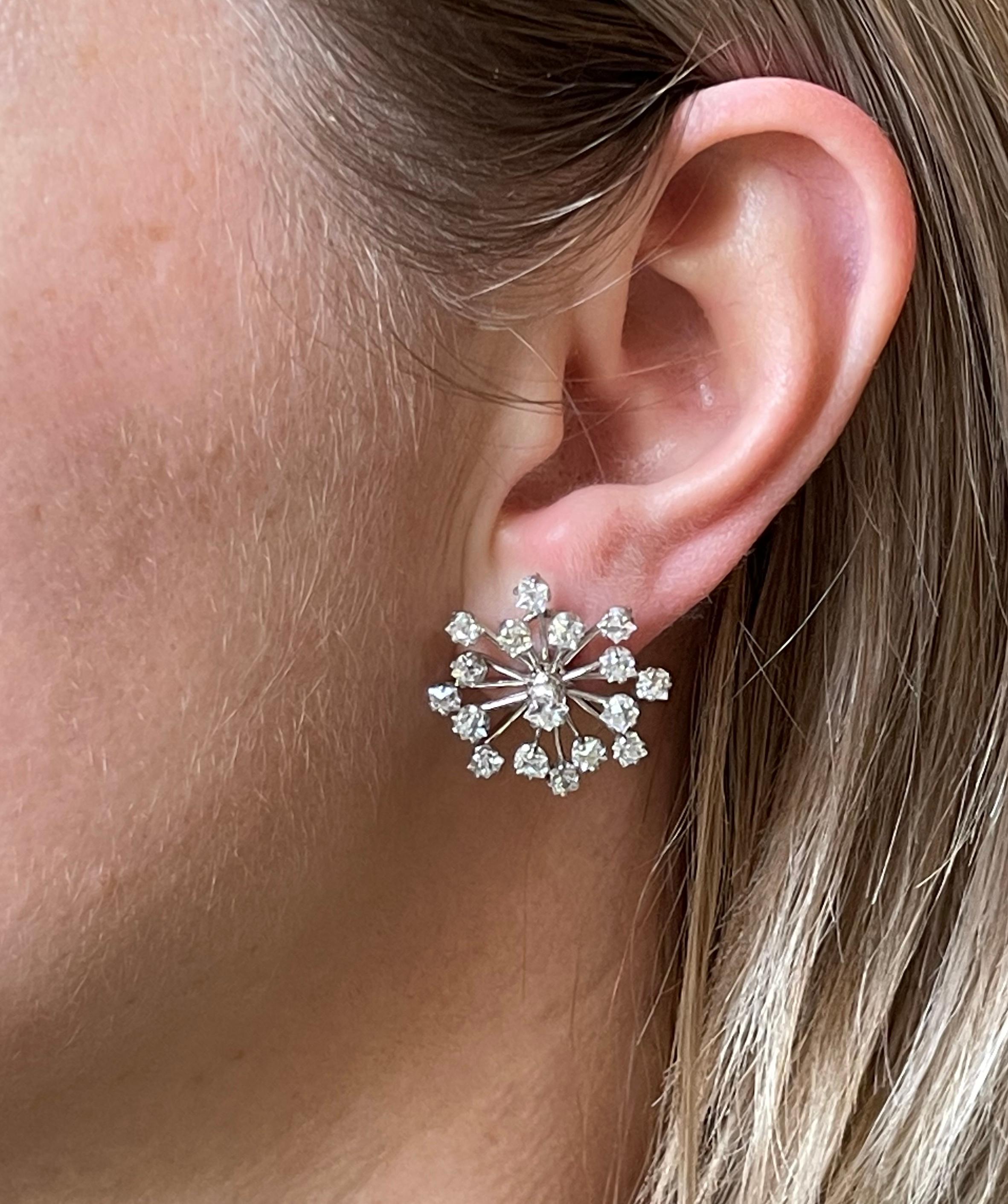 Pair of rare snowflake earrings by Tiffany & Co, in 18k gold and platinum set with approx. 3.50ctw G/VS diamonds. Earrings measure approx. 1
