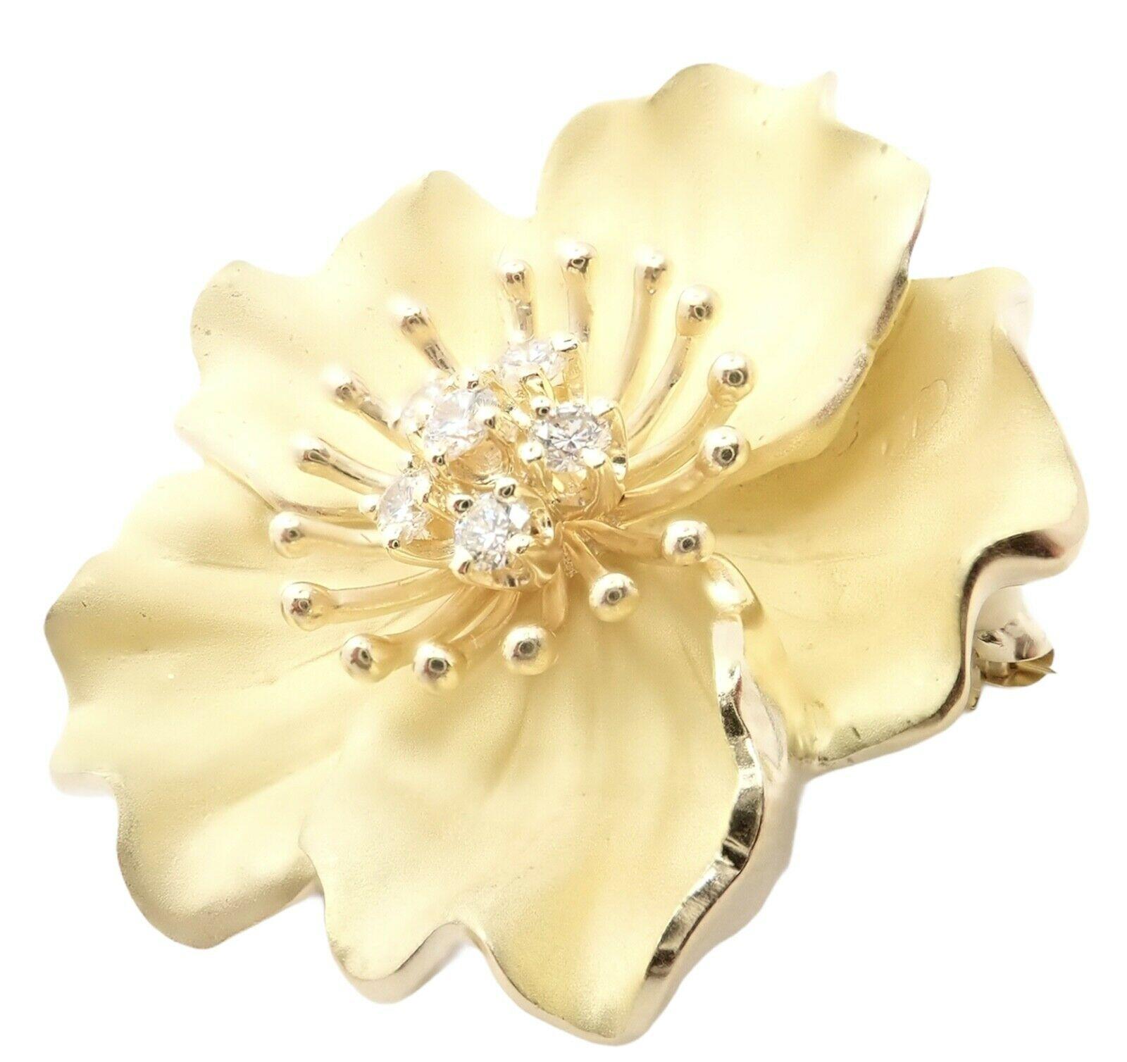 18k Yellow Gold Diamond Dogwood Pin Brooch by Tiffany & Co. 
With 6 round brilliant cut diamonds VS1 clarity, G color total weight approximately .50ct
Details: 
Measurements: 35mm x 35mm
Weight: 29 grams
Stamped Hallmarks: Tiffany & Co 750
**Free